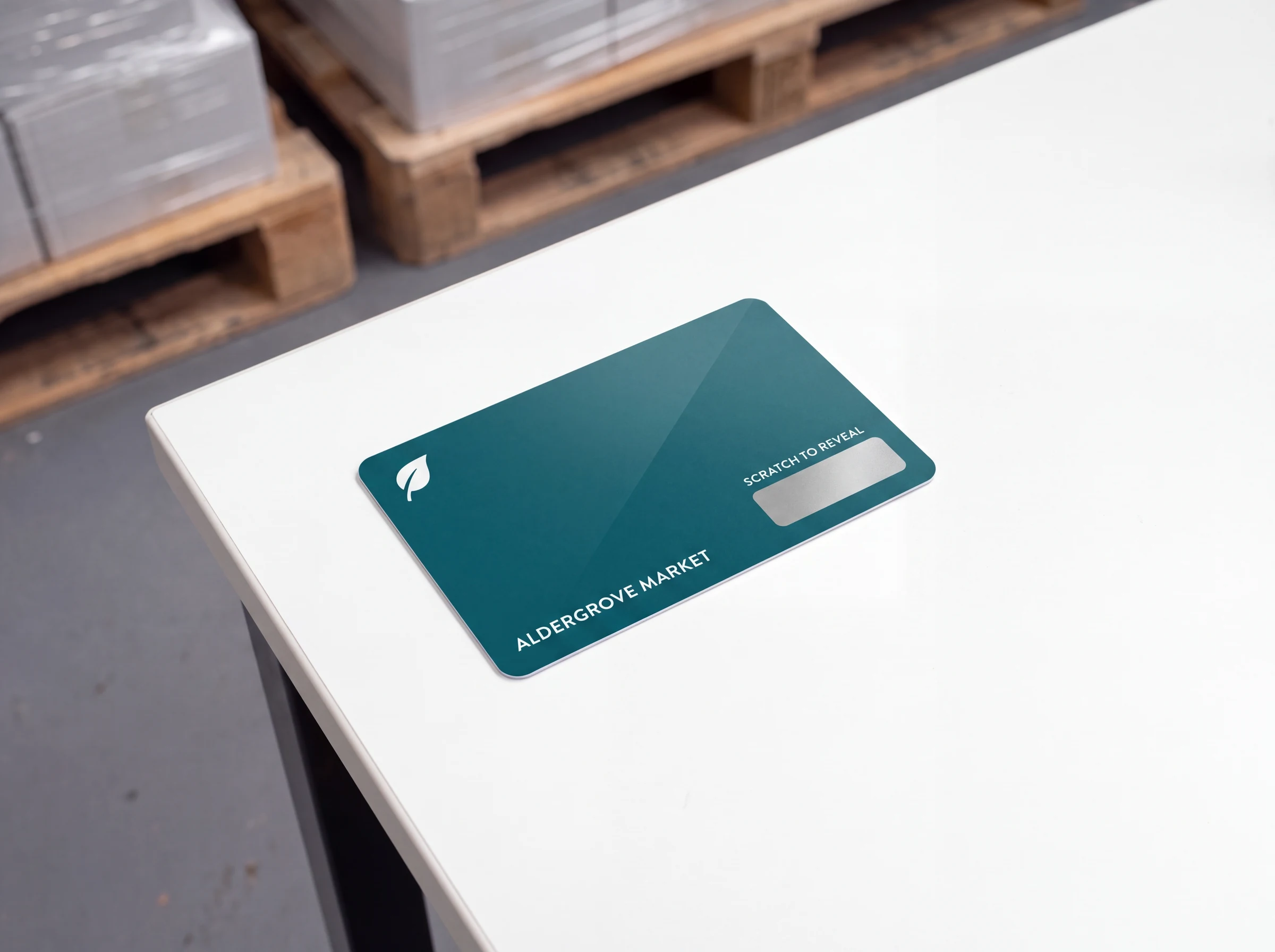 A gift card with a silver scratch panel still covering the code
