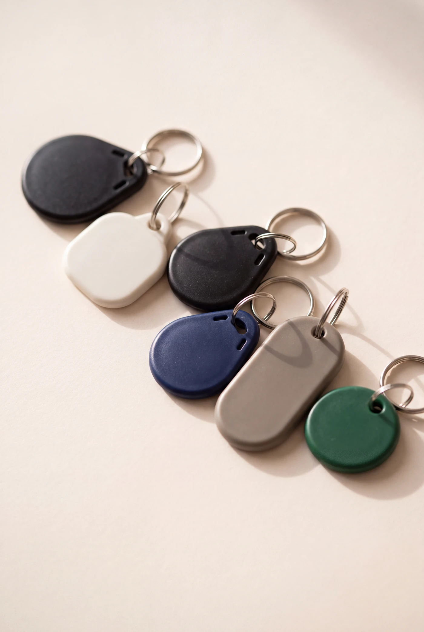 Blank ABS key fobs on split rings, in black, white, navy, grey and green