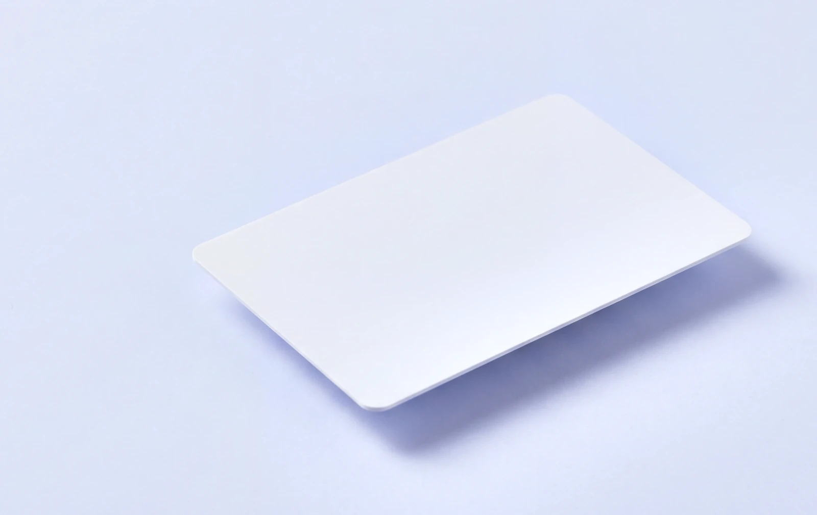 Blank white PVC card on a pale blue background, ready to be specified