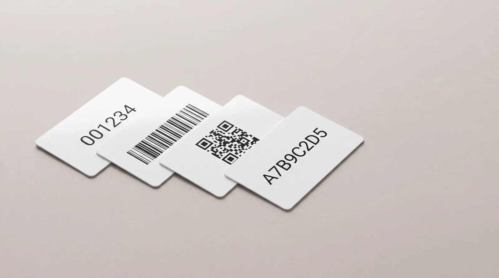Four white cards printed with a sequential number, a barcode, a QR code and an alphanumeric code