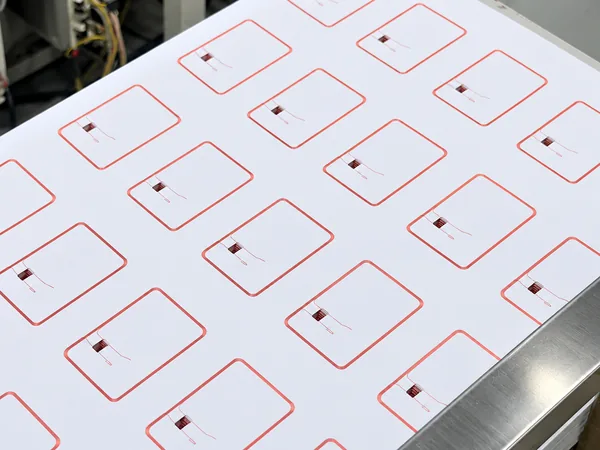 RFID inlay sheet with copper antennas and chips in place