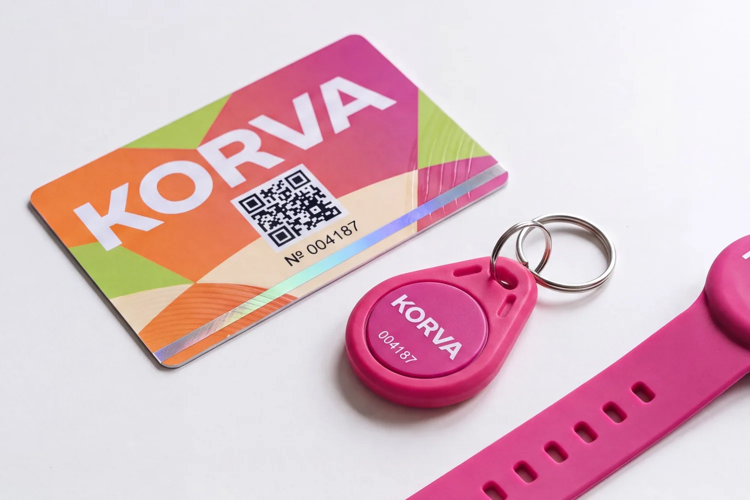 A printed access card, an ABS key fob and a silicone wristband from the same order