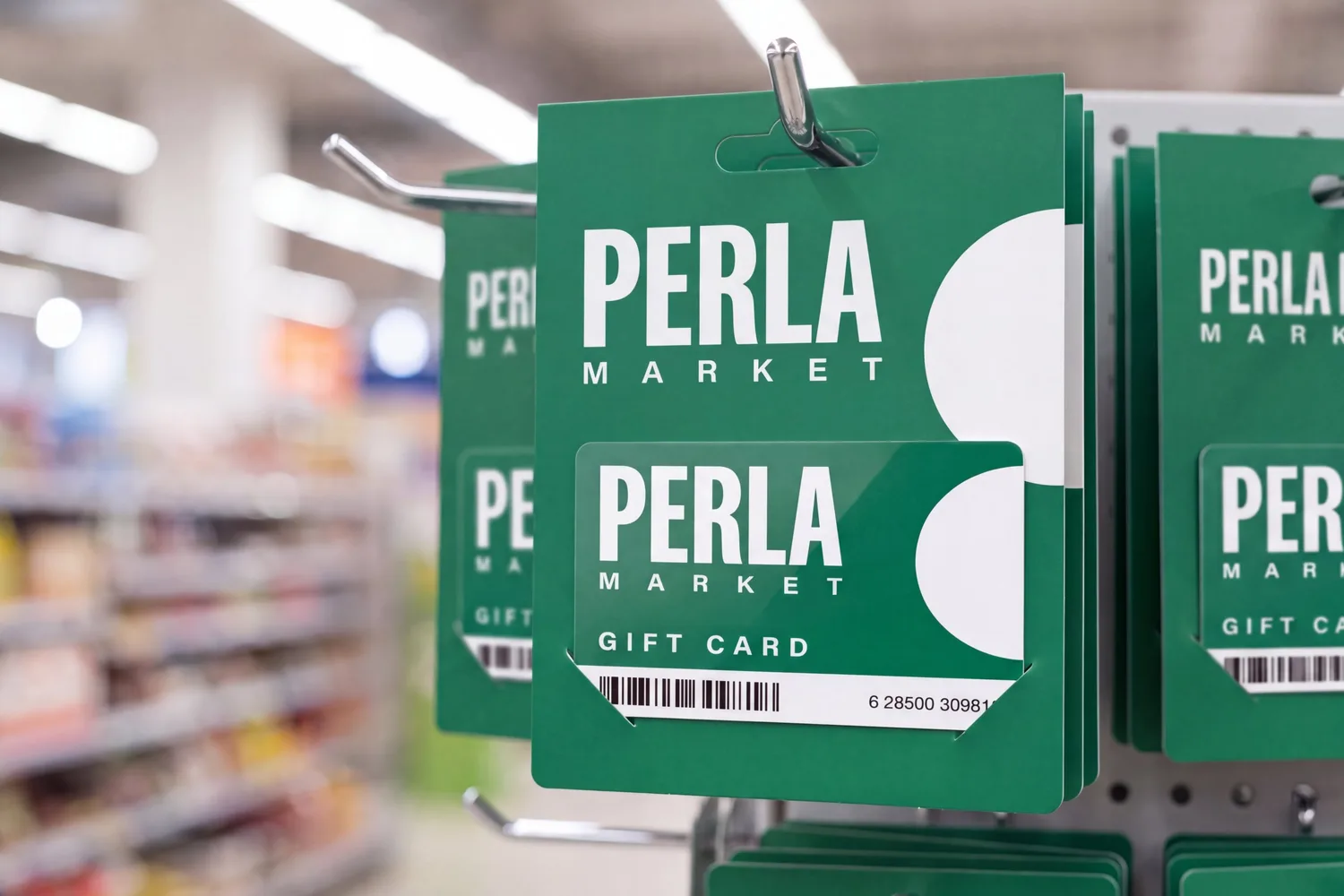A gift card seated in its printed hanging carrier on a store display hook, card and carrier printed from one artwork file