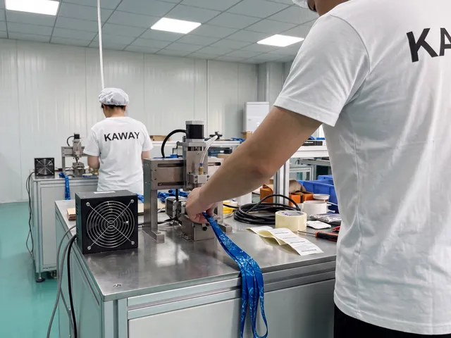 Operator sealing a printed lanyard on a finishing machine