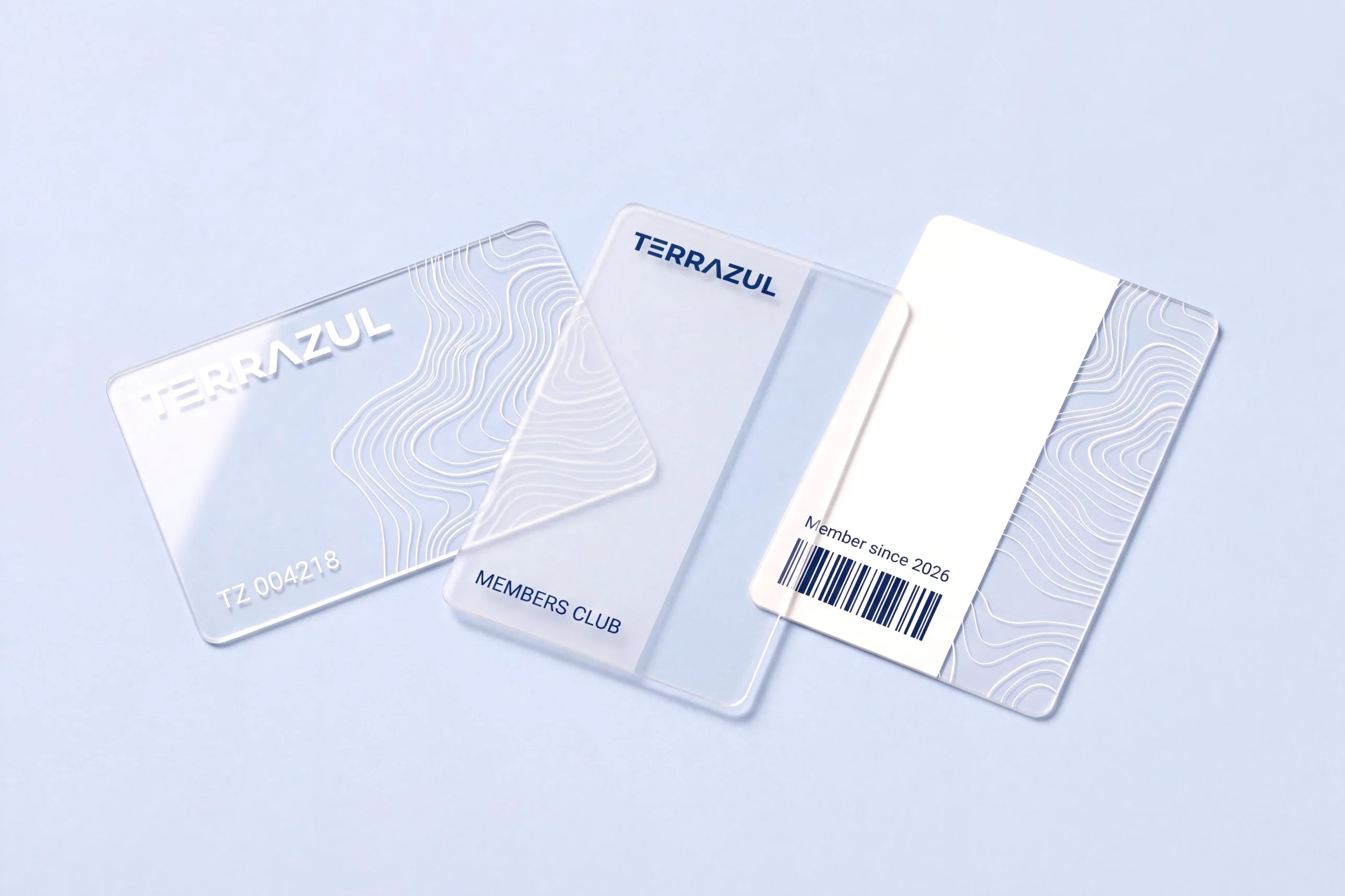 Three transparent PVC member cards: one clear with white contour lines, one frosted with a clear strip, one half printed in white with a barcode