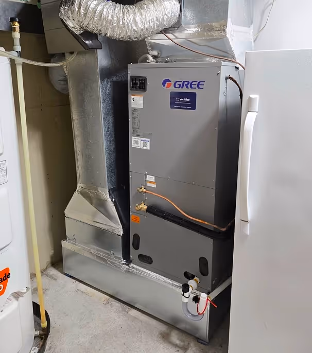 Unité de climatisation Gree installée au sous-sol avec conduits isolés