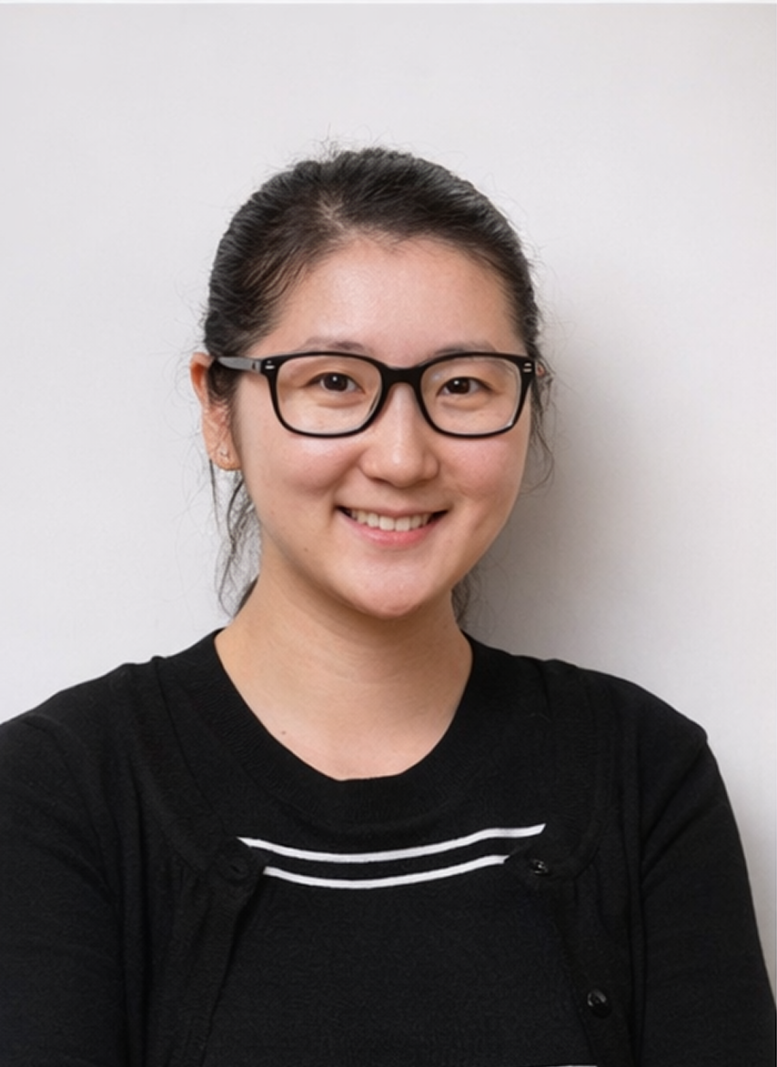 Olivia Pan, Associate Director of Vitas Advisory, smiling on a studio portrait