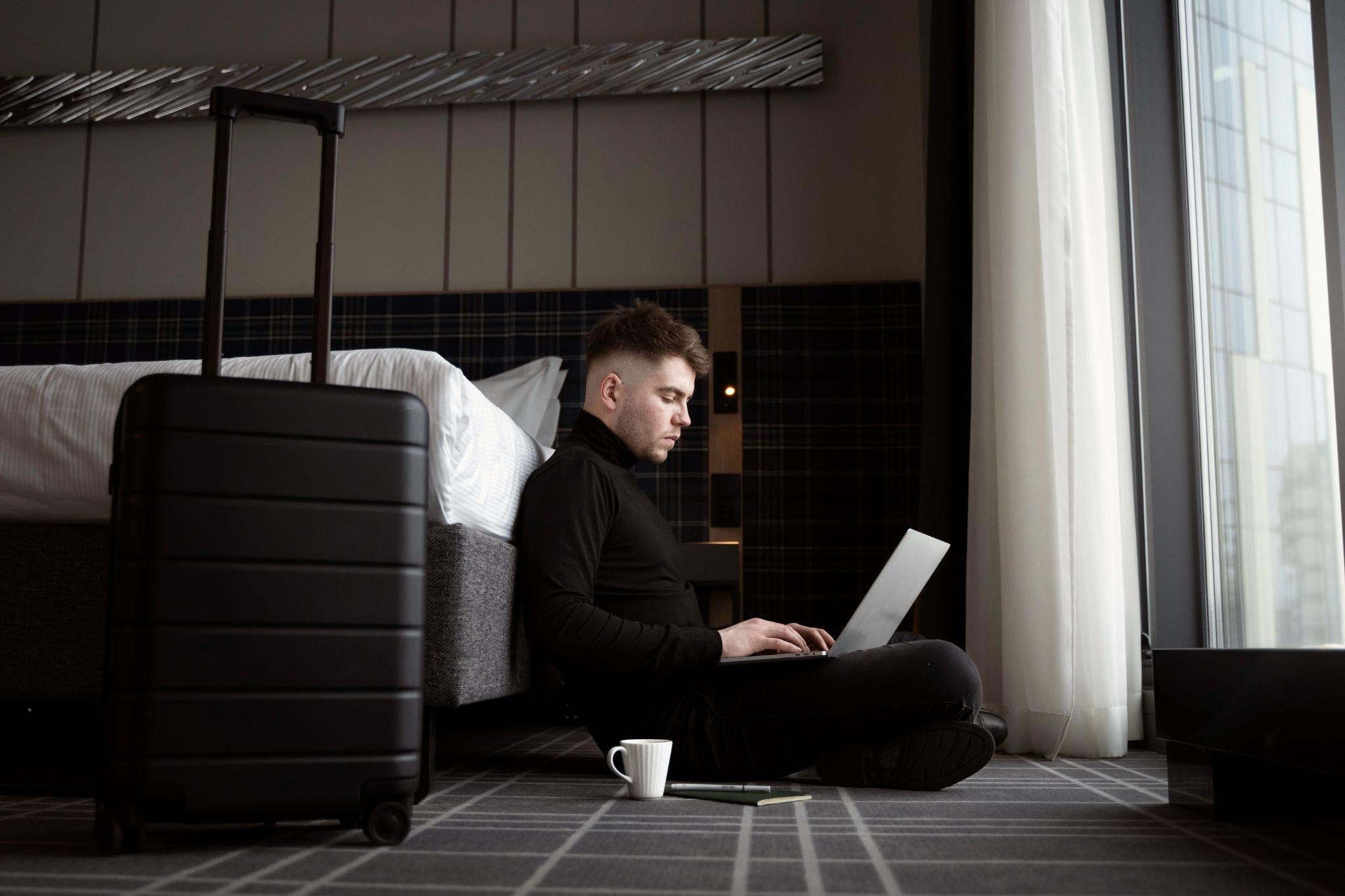 source: https://www.freepik.com/free-photo/young-man-working-his-laptop-hotel-room_23443089.htm#fromView=search&page=1&position=41&uuid=c74de5b9-92e7-4be5-a123-a1b6af1d8c0a&query=man+lagguage+hotel