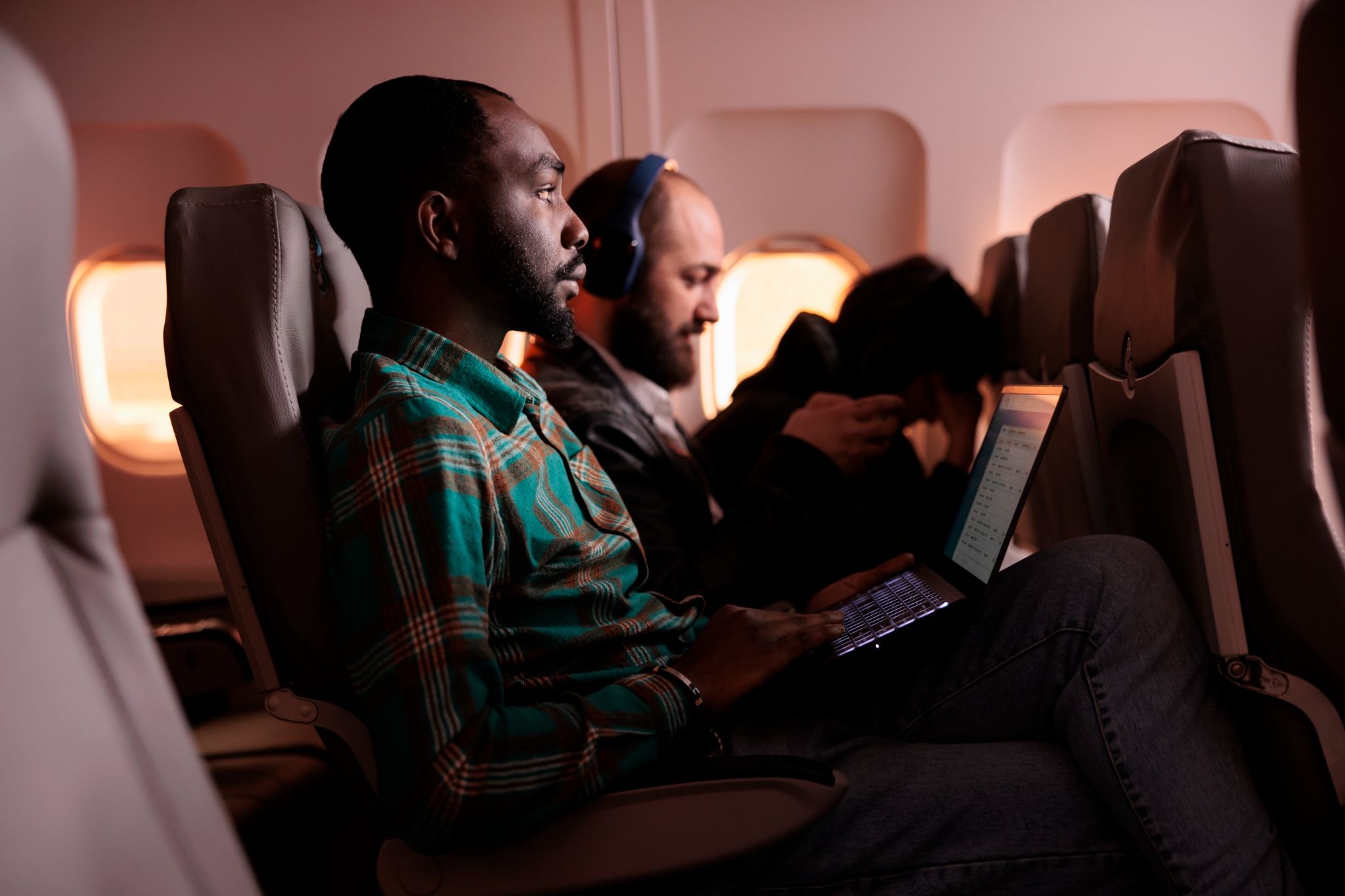 source: https://www.magnific.com/free-photo/young-businessman-travelling-economy-class-using-laptop-flight-flying-abroad-holiday-destination-work-trip-working-computer-sunset-aerial-transportation_32500508.htm#fromView=search&page=1&position=16&uuid=d55eef12-0f55-445e-bdfb-3eba86ad3330&query=ghana+plane