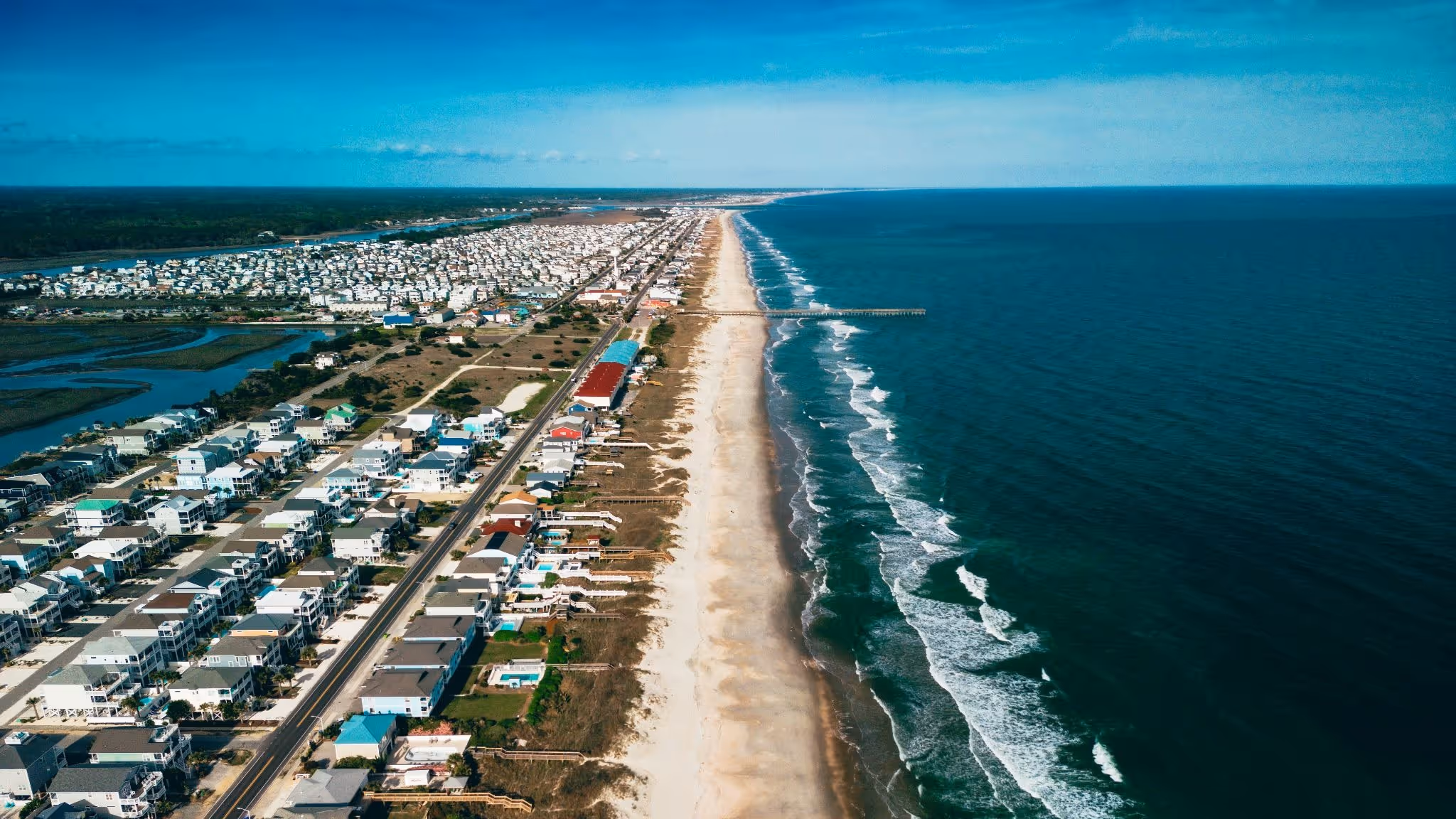 source: https://unsplash.com/photos/an-aerial-view-of-a-beach-and-a-city-Pp6CnSurGQ4