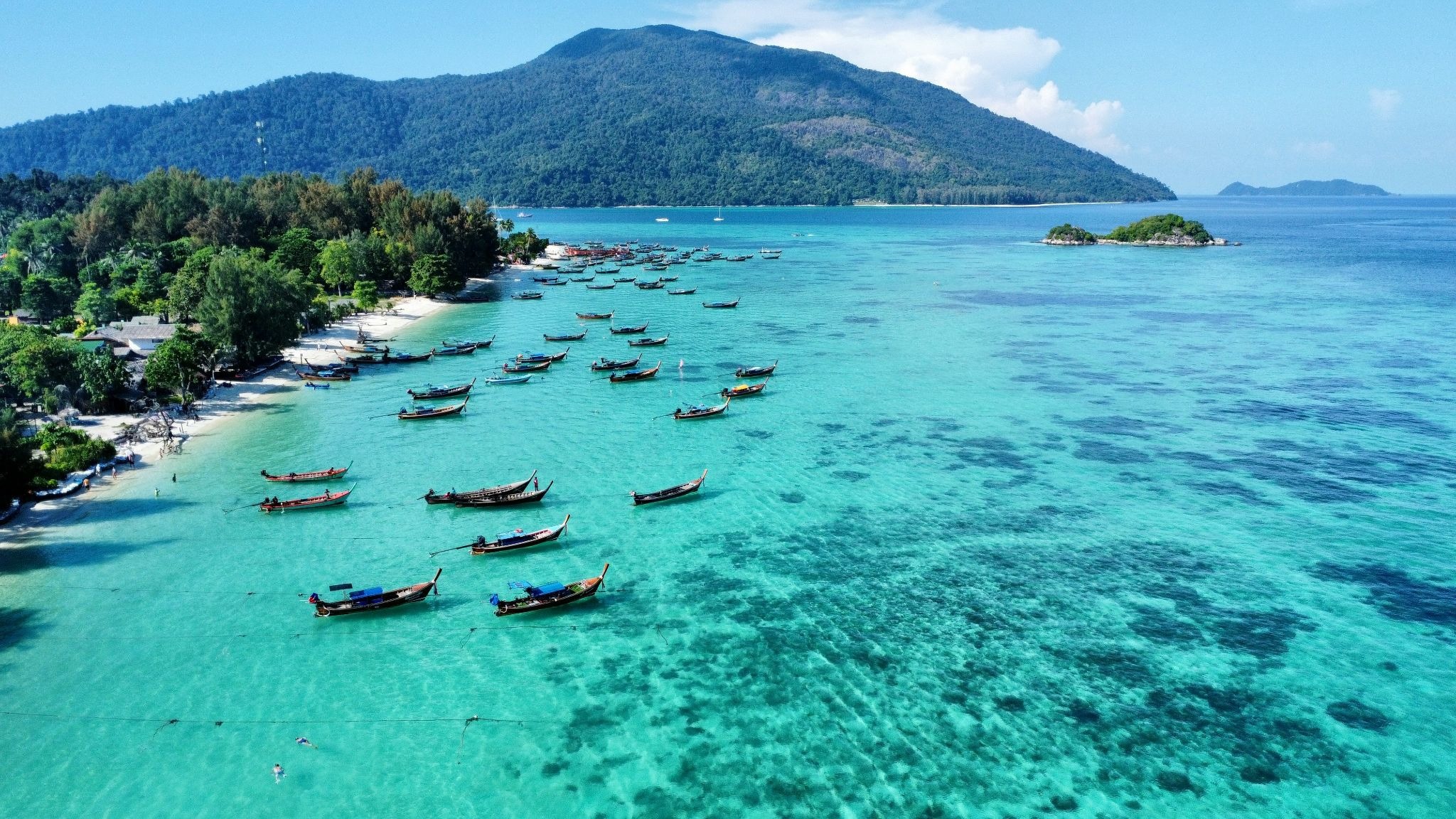 source: https://unsplash.com/photos/a-group-of-boats-floating-on-top-of-a-body-of-water-HbASCX34NTw