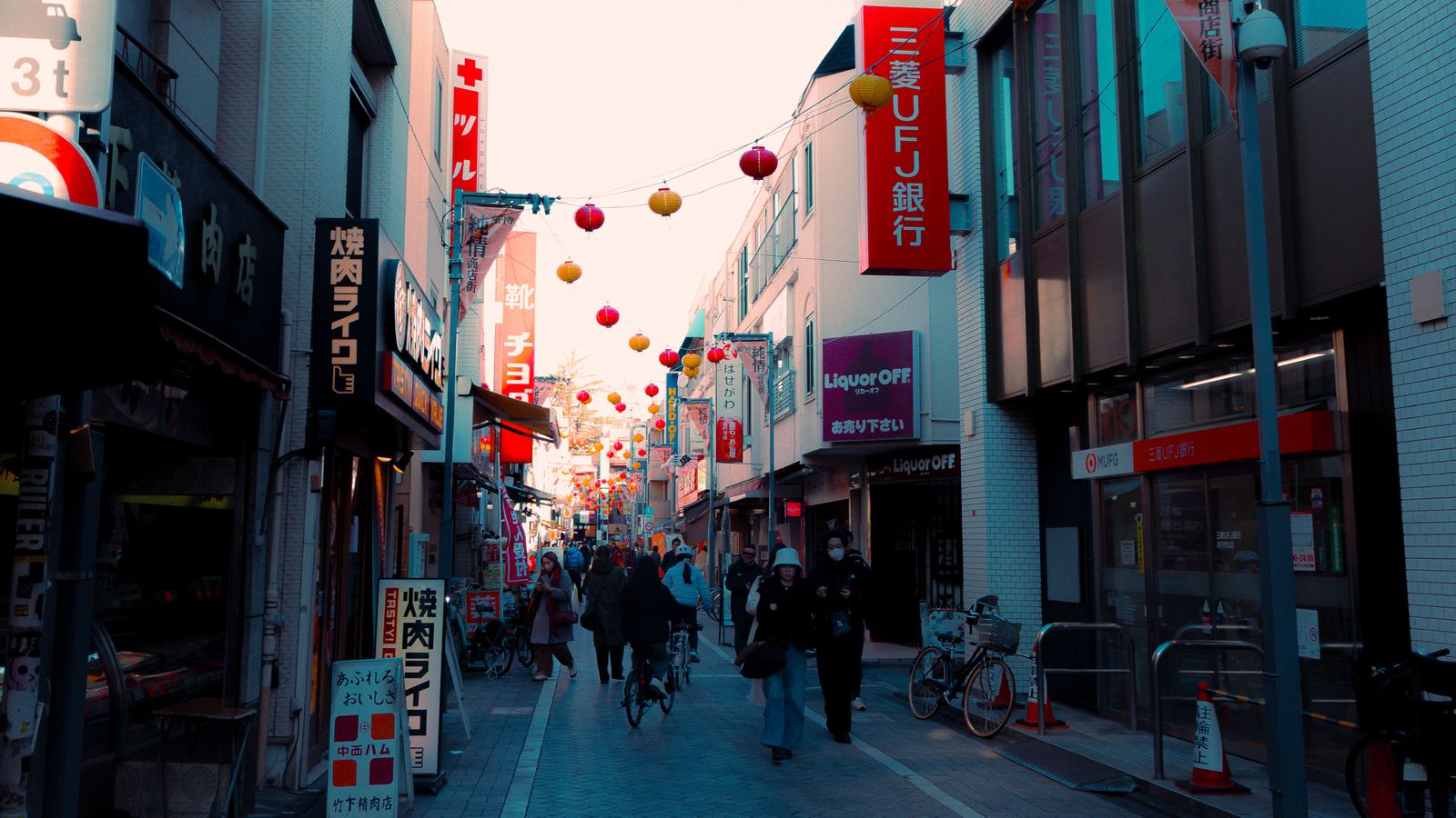 Lively night market stalls lit by lanterns