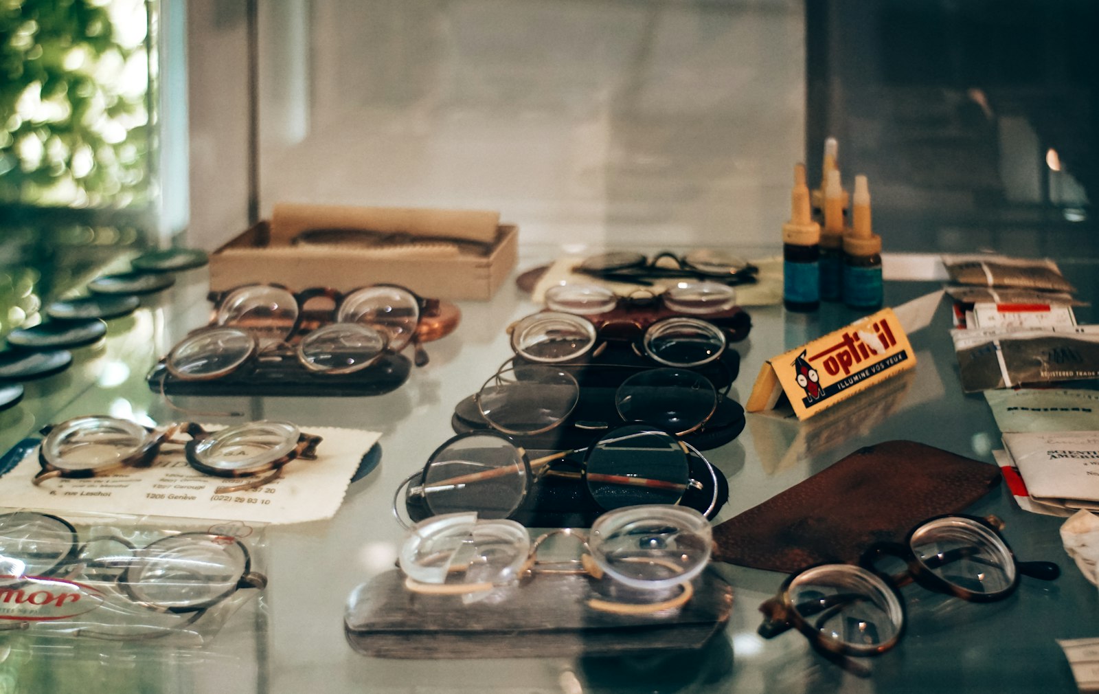 Assortment of vintage eyeglasses displayed in a shop