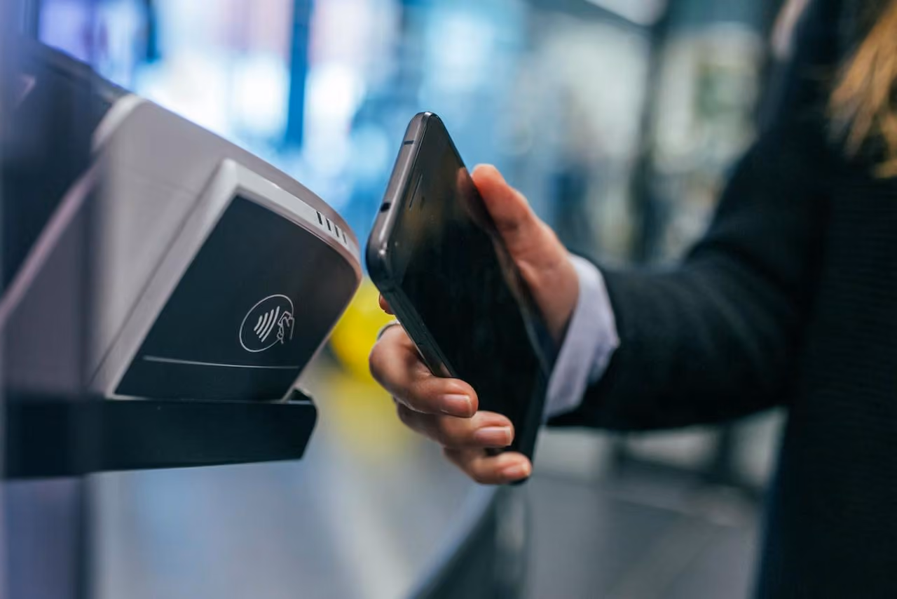 Phone tapping contactless payment at checkout