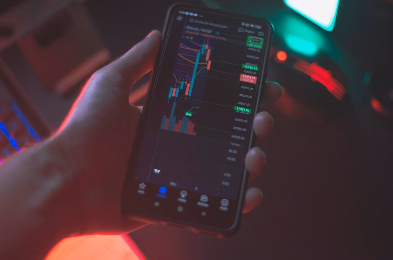 Mobile cryptocurrency trading app showing live price prediction and trading signals
