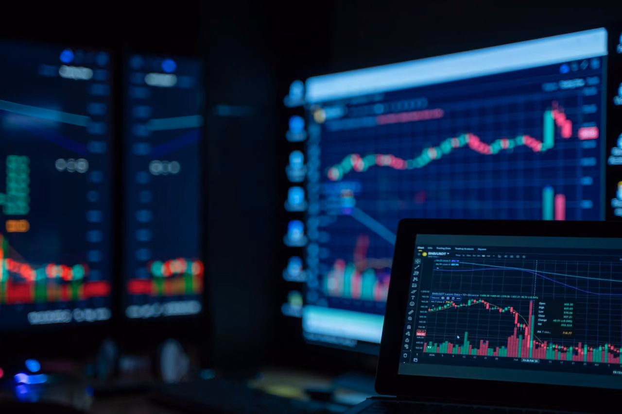 Laptop showing financial charts with cash and investment analysis