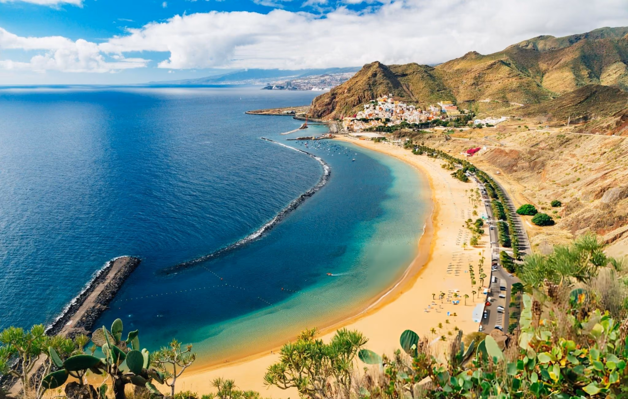Playa de las Teresitas golden beach with turquoise water and mountain backdrop, Tenerife.