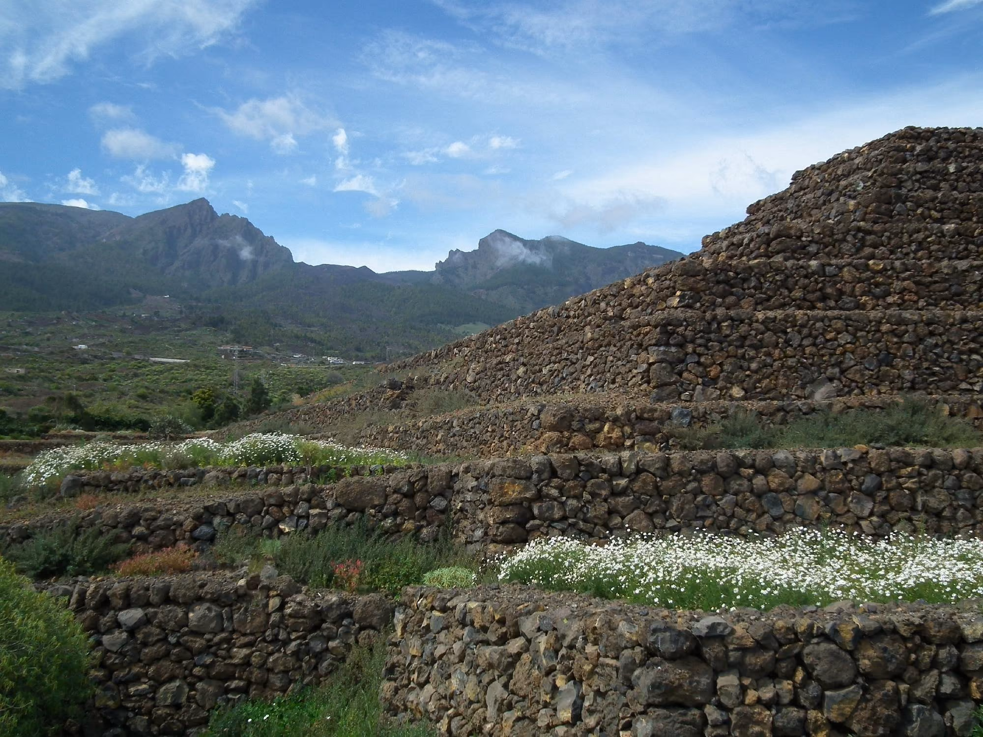 Stepped stone pyramids at Güímar with mountain backdrop, Tenerife.
