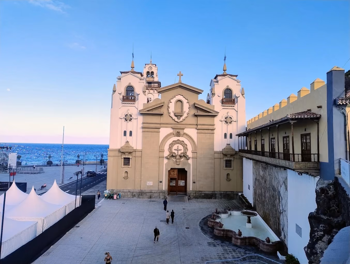 Basilica of Candelaria facade with ocean view at dusk, Tenerife.