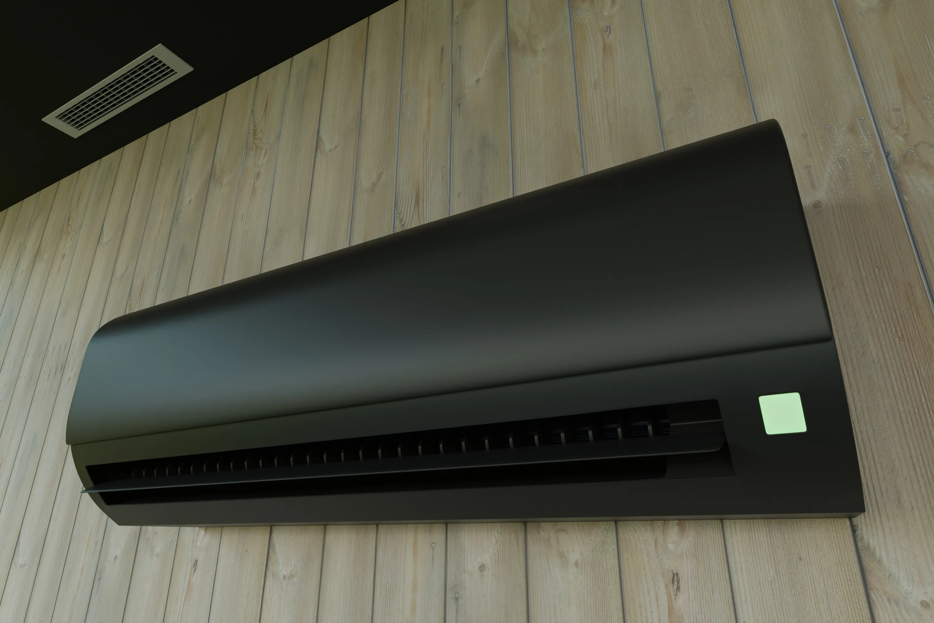 Musta ilmastointilaite puuseinällä, vihreä valo.