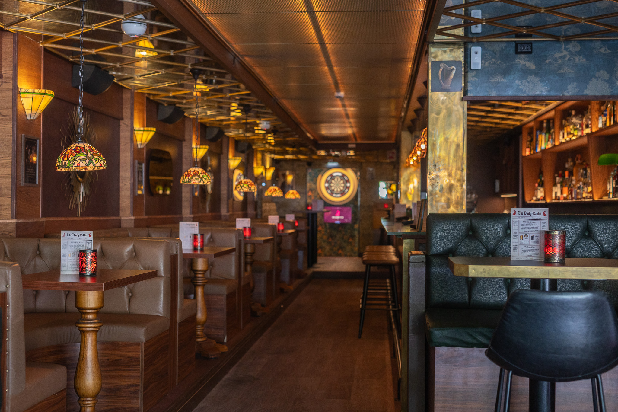 The interior of Red Rabbit Pub Oslo, dark wood and warm lighting