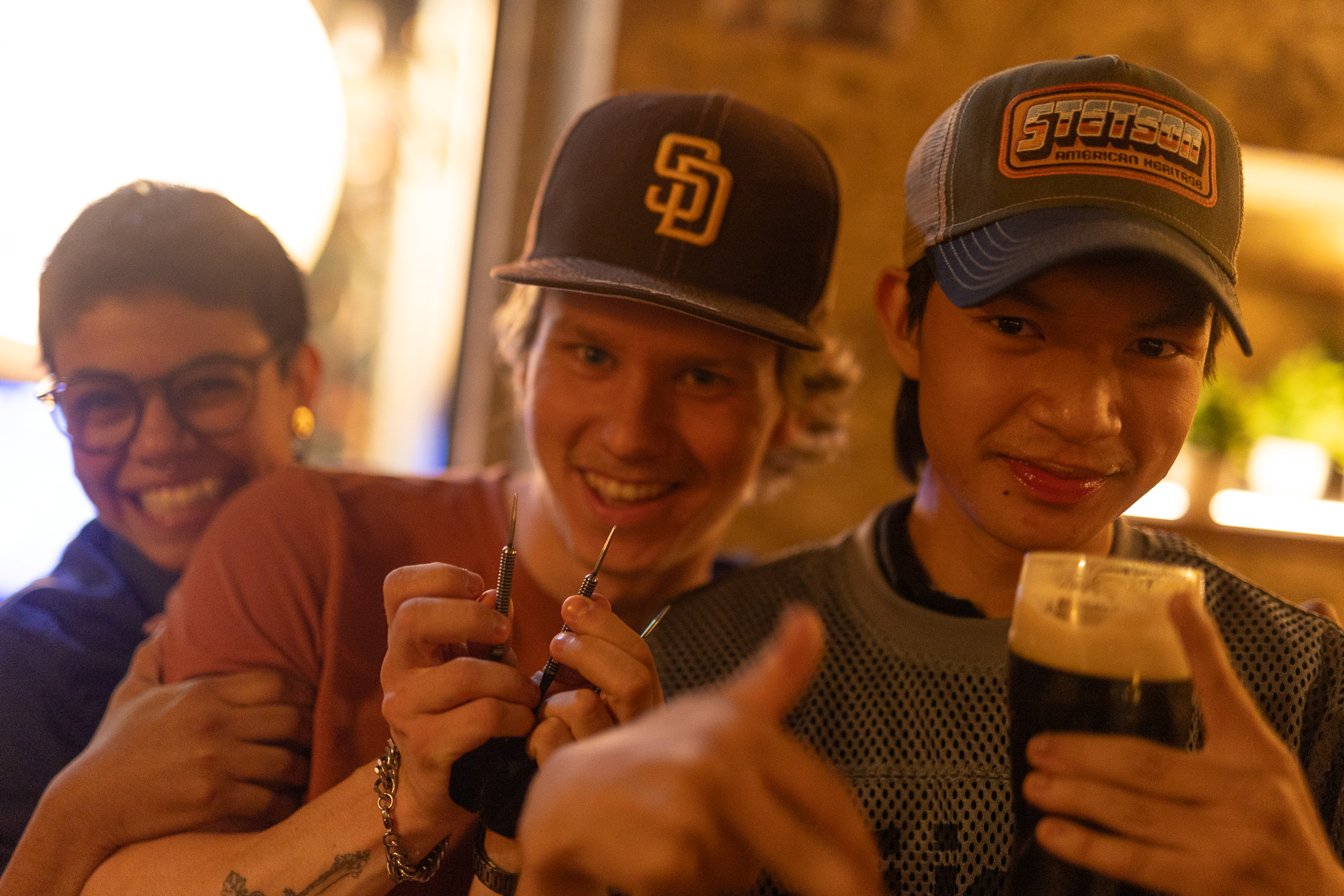 Friends smiling together at Red Rabbit Pub Oslo