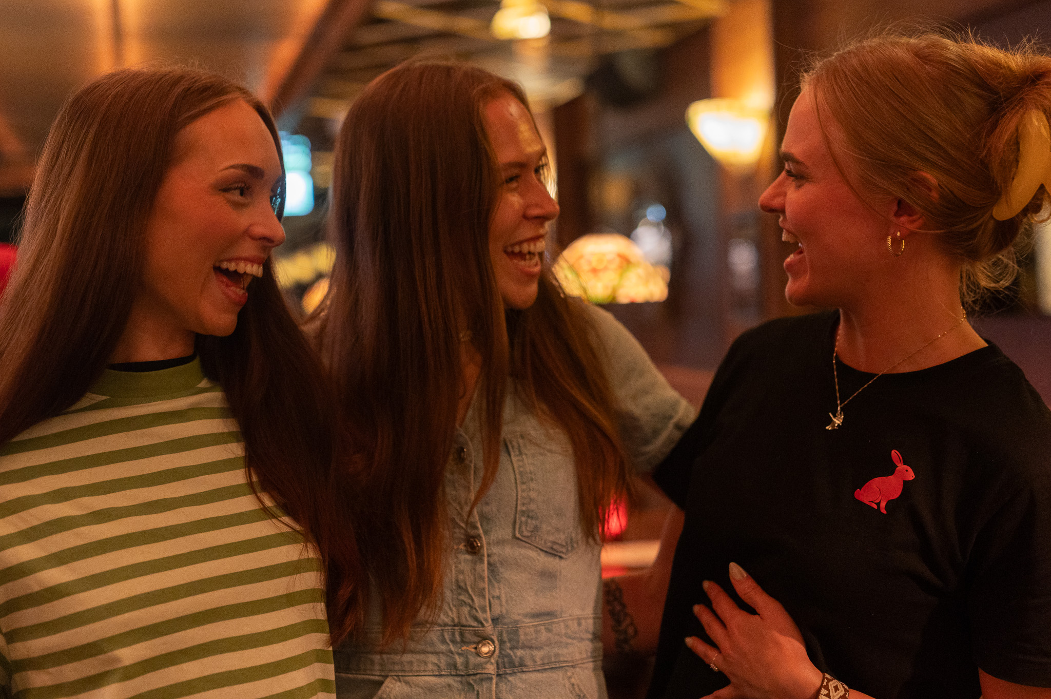Friends laughing together at Red Rabbit Pub Oslo