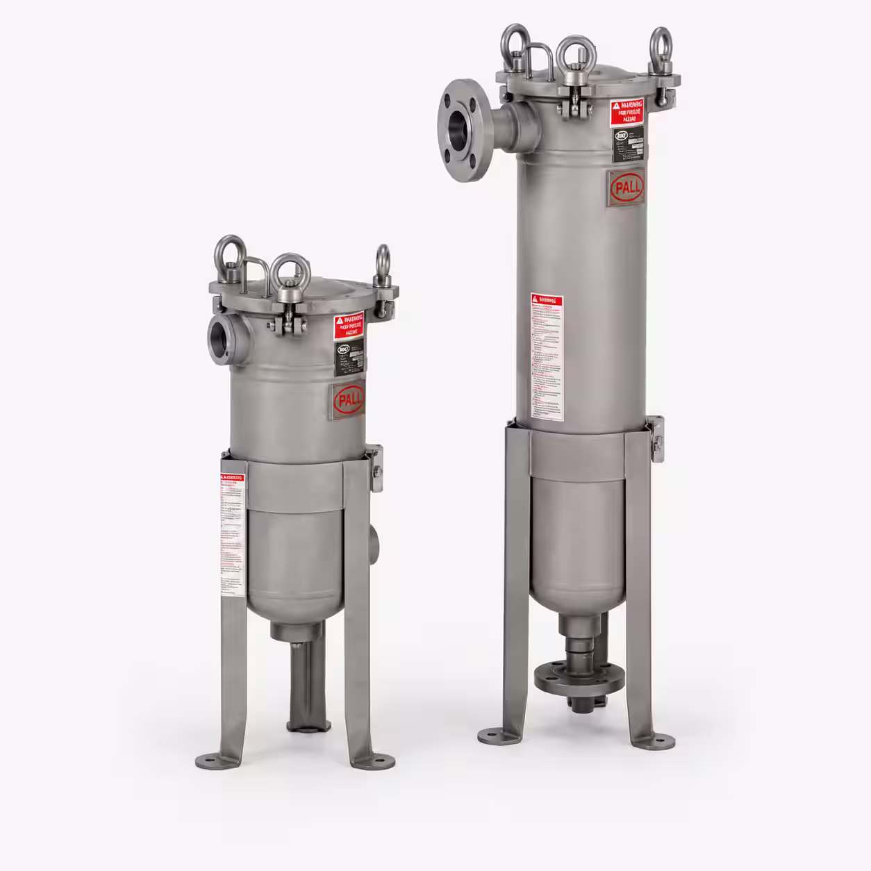 Two vertical stainless steel industrial filter housings with flange inlets and tripod supports.