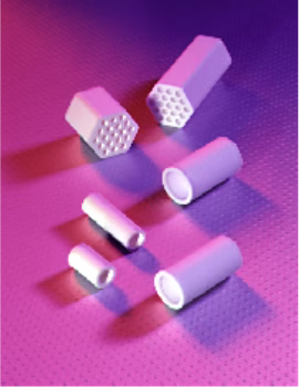Various hexagonal and cylindrical ceramic filters arranged on a purple surface with pink lighting.