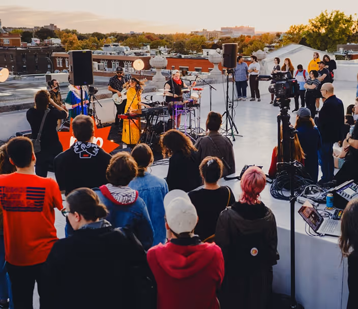 An outdoor rooftop scene of the festival.