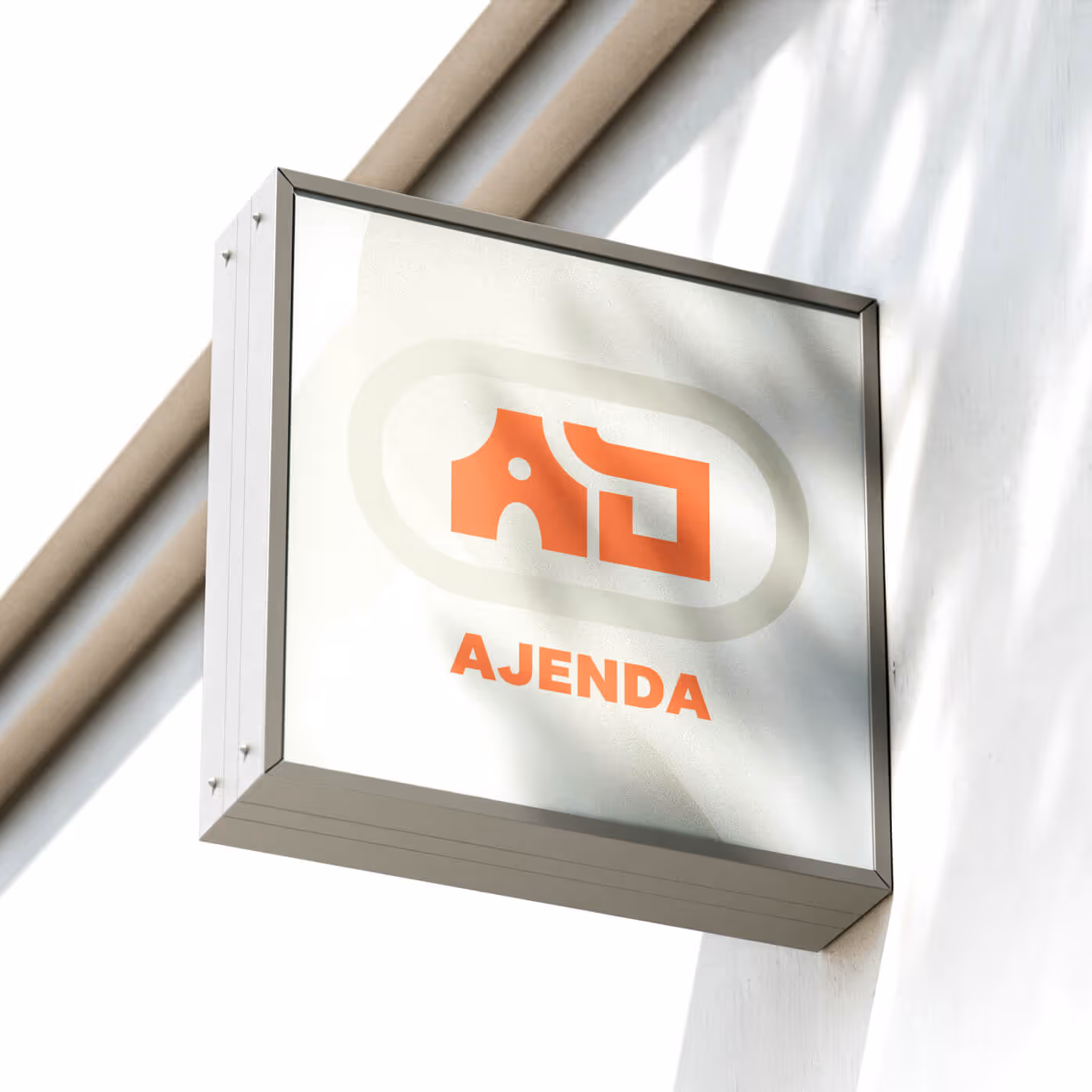 Ajenda storefront signage with orange and beige logo on light beige abstract background