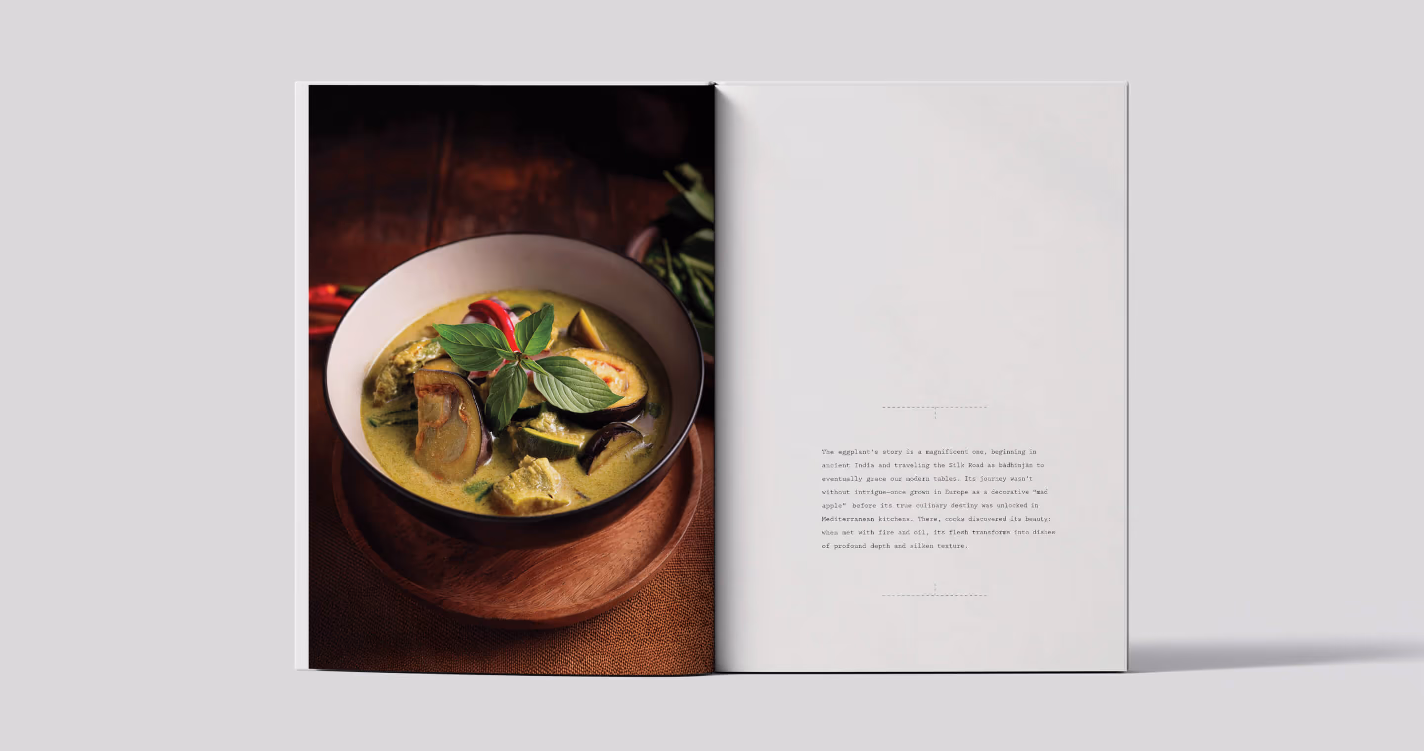 Cookbook spread with recipe introduction and full bleed image of eggplant meal