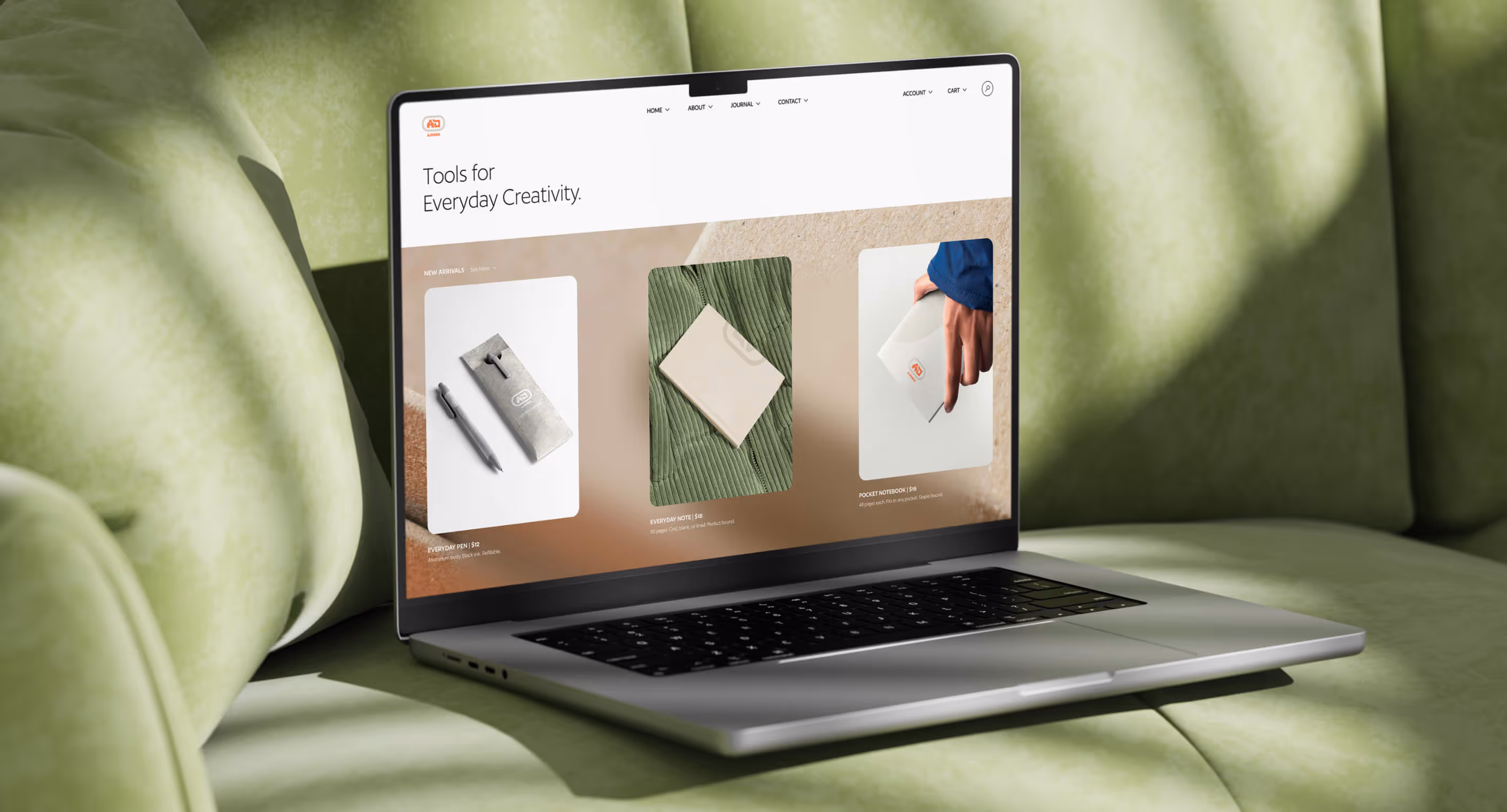 Ajenda homepage web design with stationery products displayed on blurred background with clean sans serif navigation