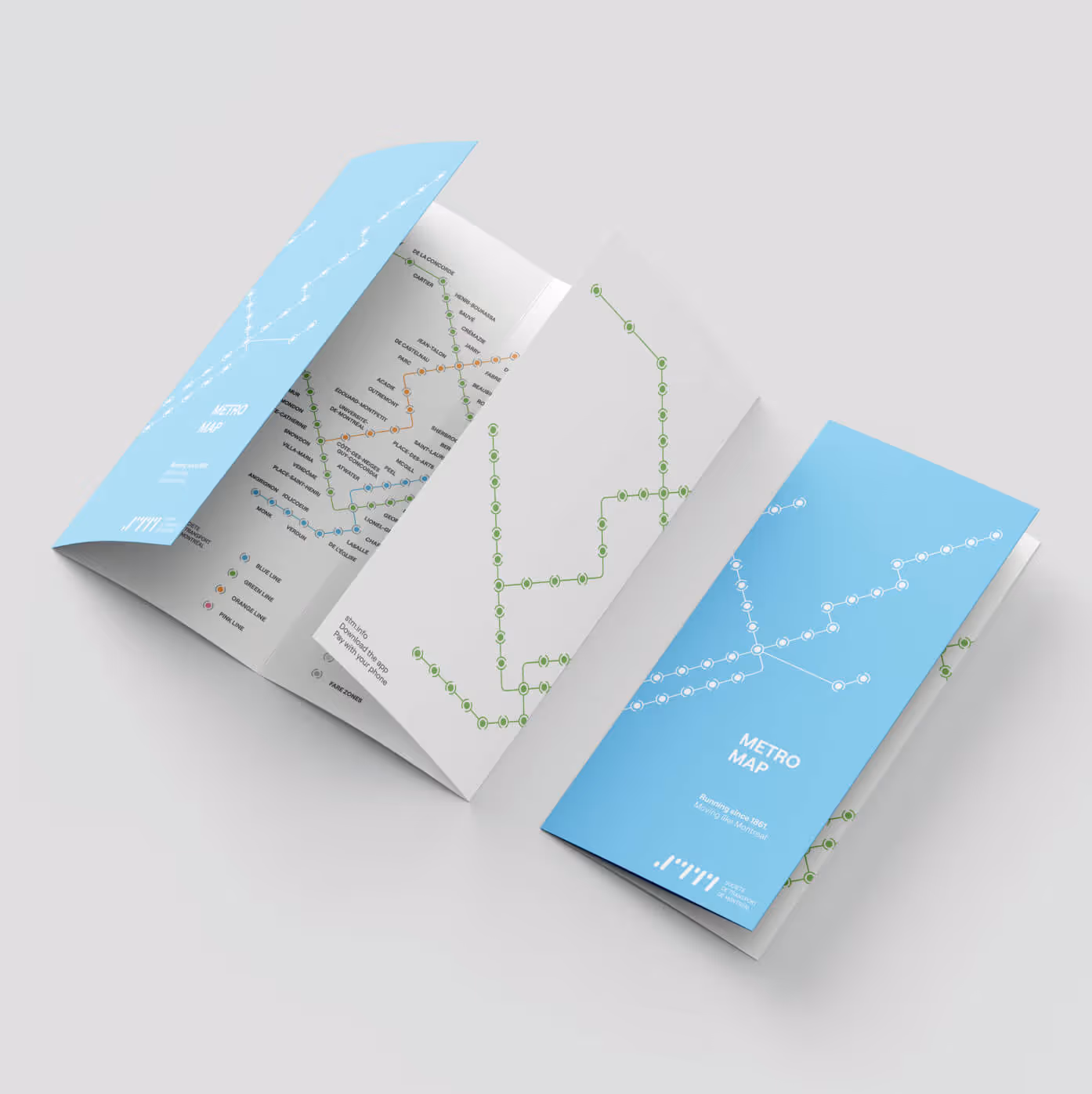 STM pamphlet folded brochure showing new metro map with green and white route lines on blue paper