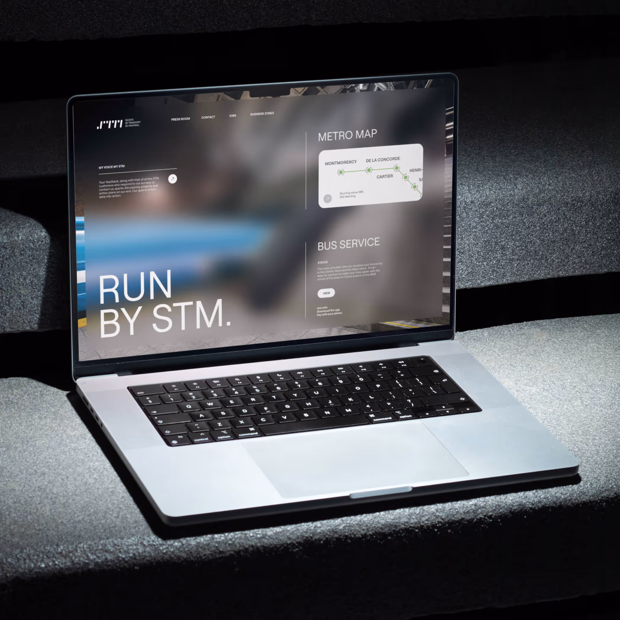 STM homepage web design with full width metro photography and sans serif typography
