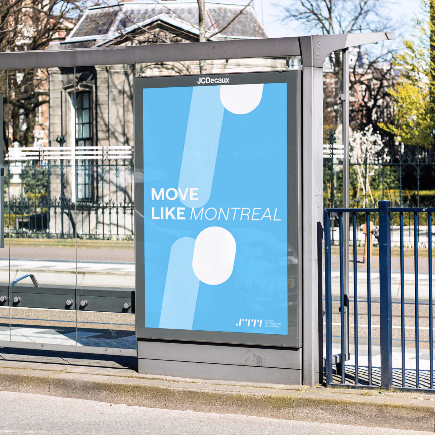 STM advertising poster with white logo pattern and sans serif typography on blue background promoting metro system rebrand