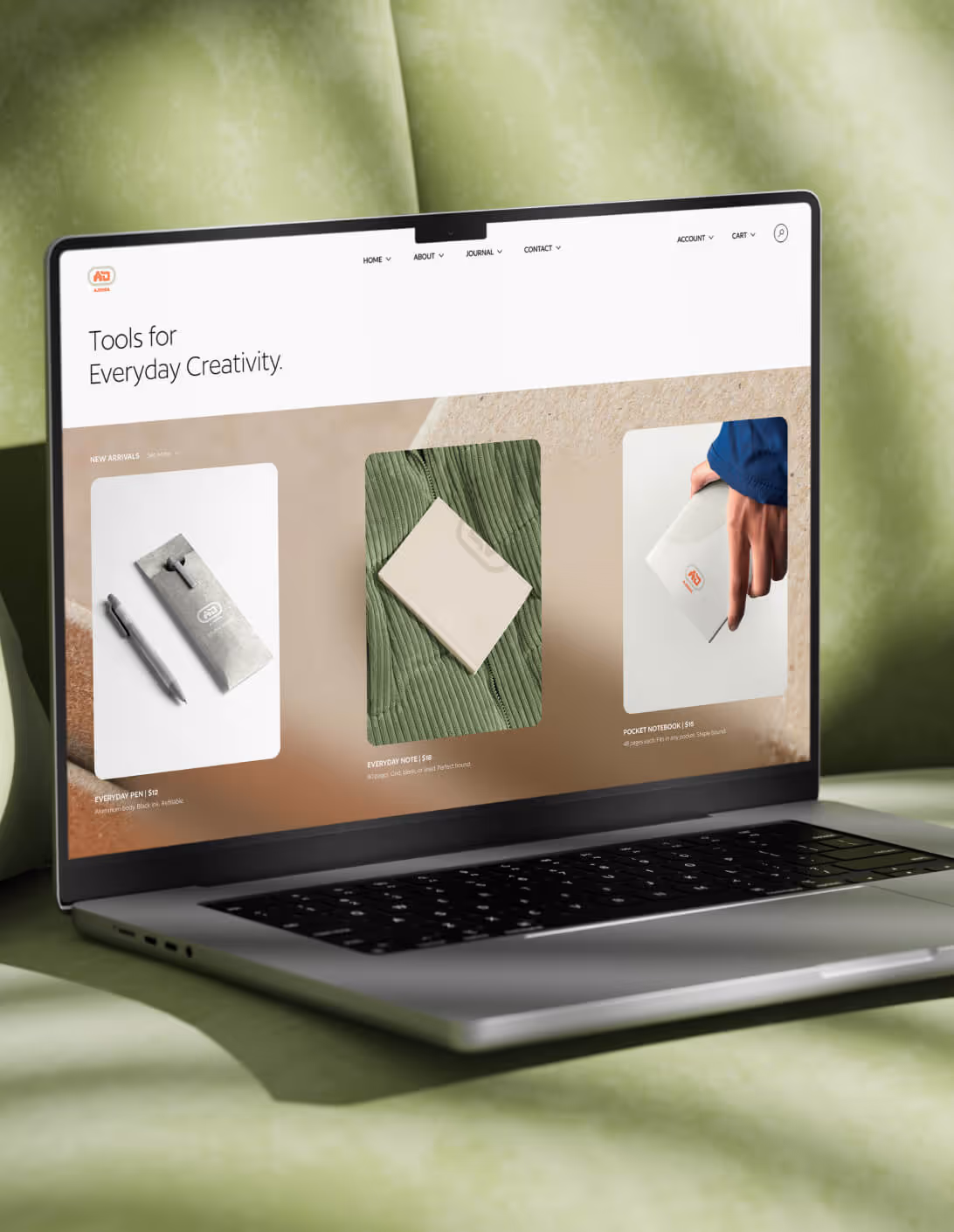 Ajenda homepage web design with stationery products displayed on blurred background with clean sans serif navigation