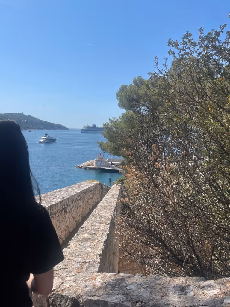 Aki standing near riviera