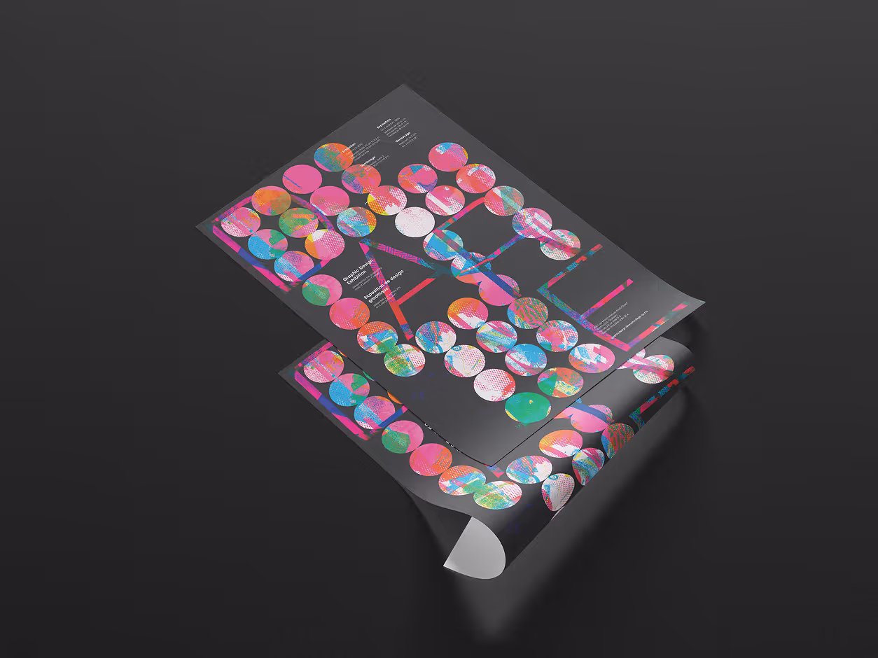 Two poster sheets placed on a black background at an angle