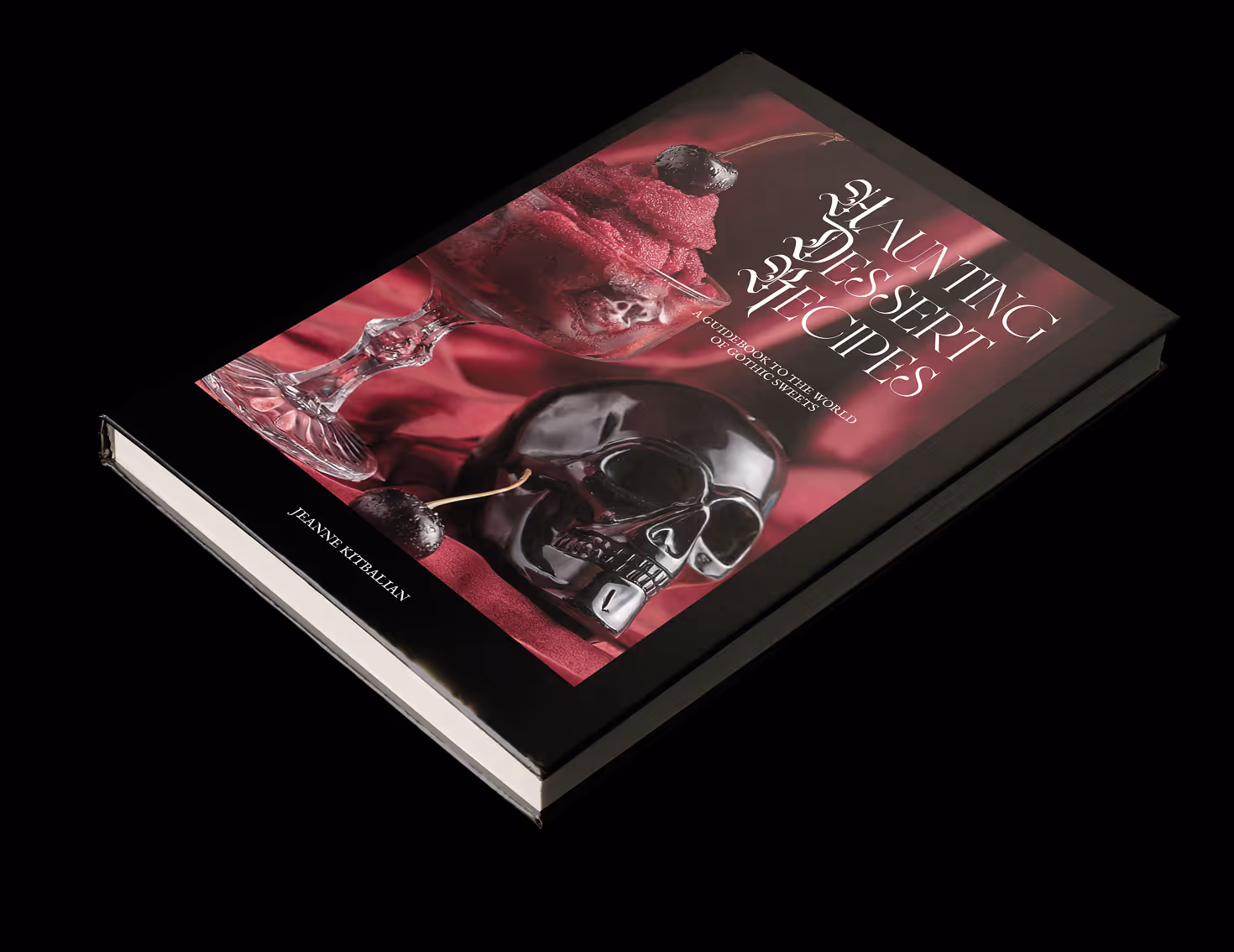 A dessert cookbook positioned from an angle on black background