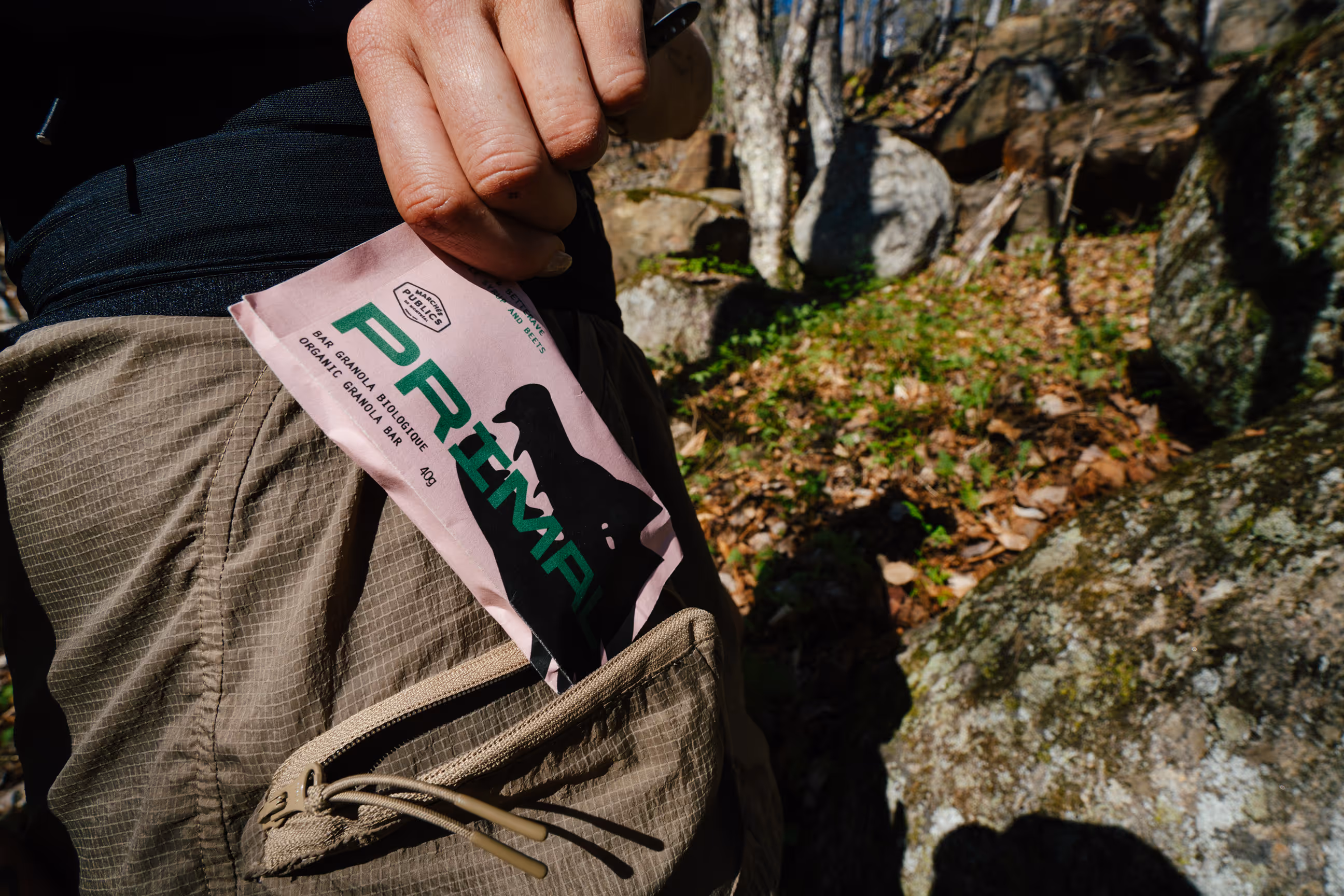 Granola bar being removed from pocket. Photo credit Felix Burke.
