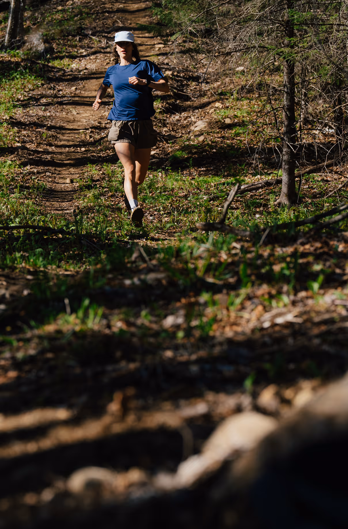 Woman running downhill. Photo credit Felix Burke.
