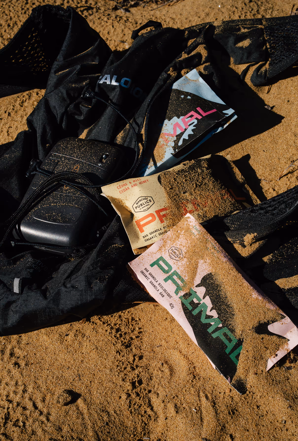 Photo credit felix Burke. Image of primal granola bar in sand