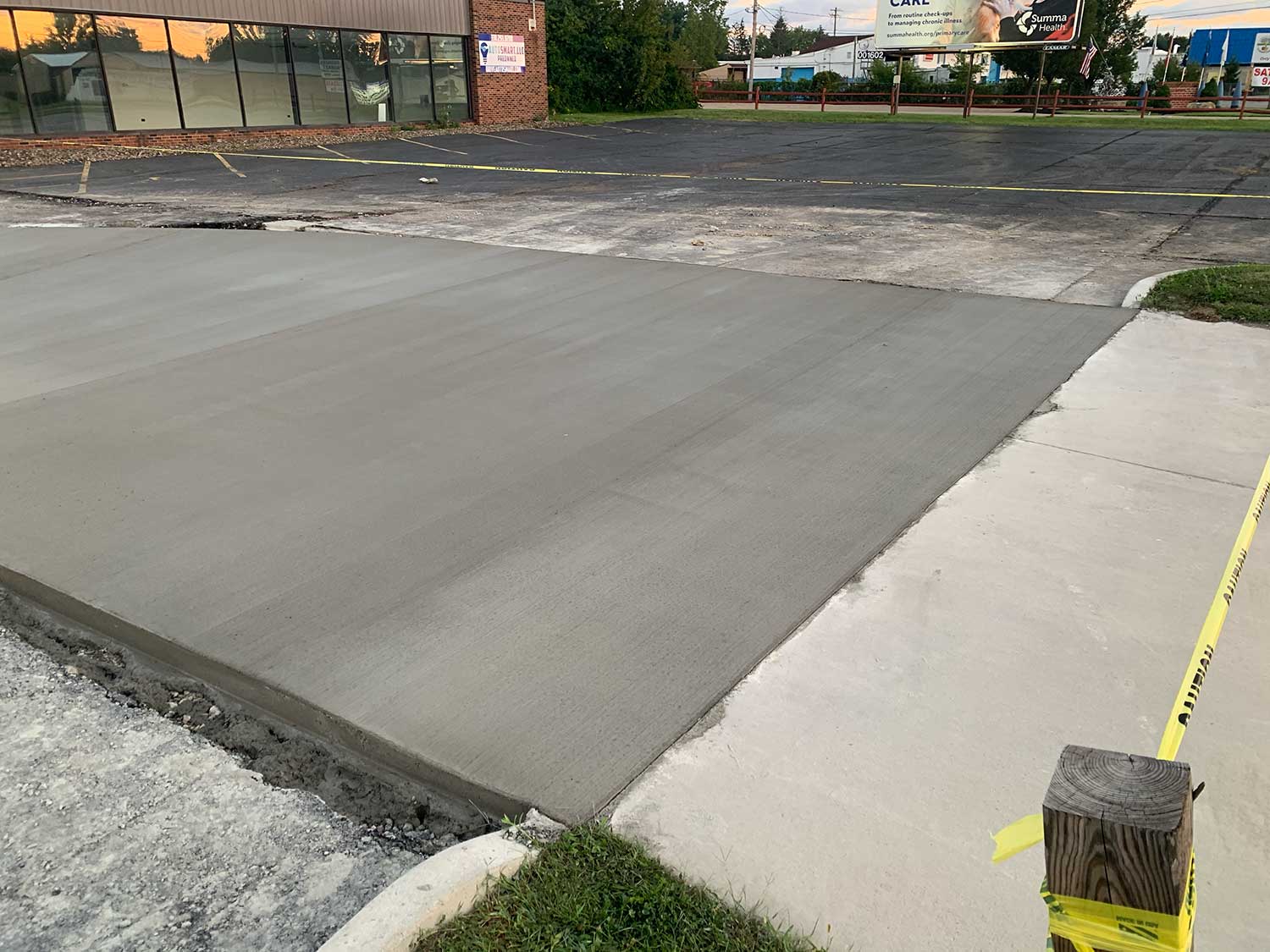 Concrete sidewalk and curbing installation with precise forming and clean finish