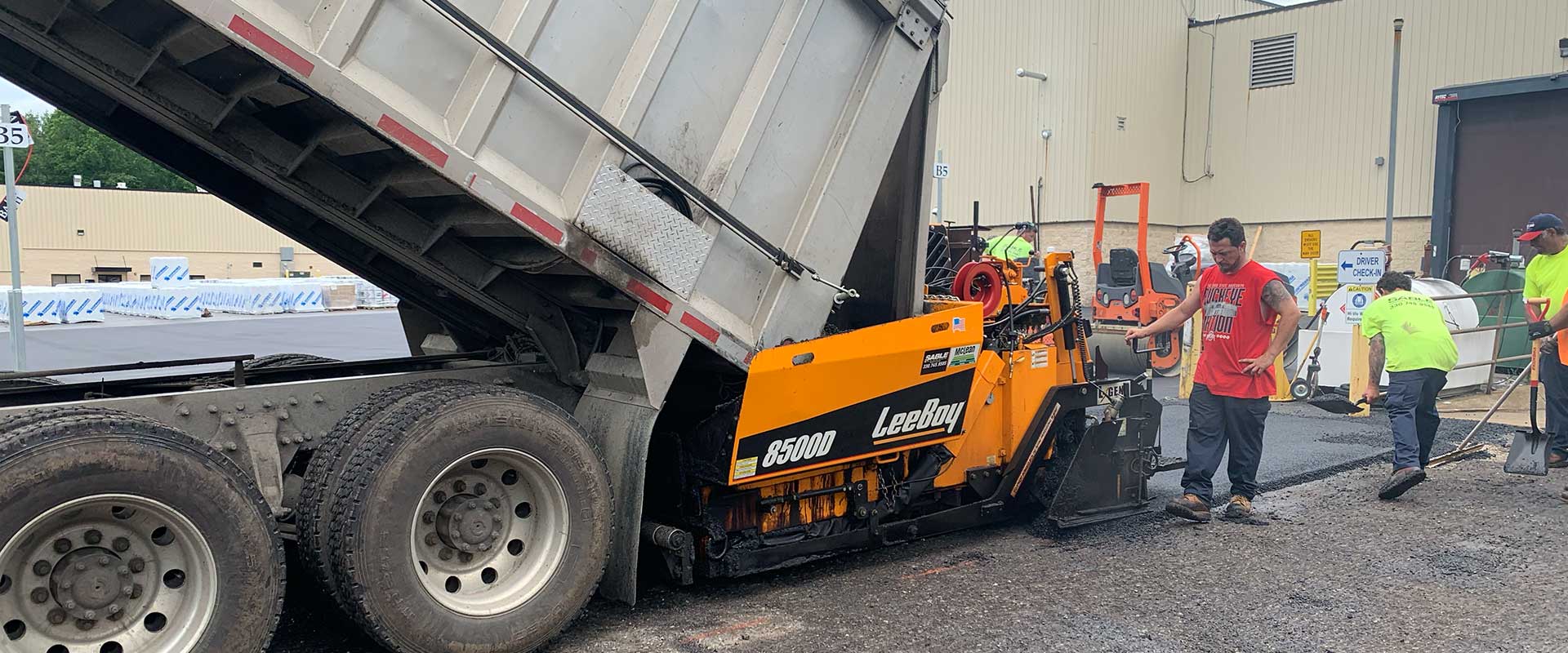 Northeast Ohio Asphalt Crew paving a smooth, durable parking lot.