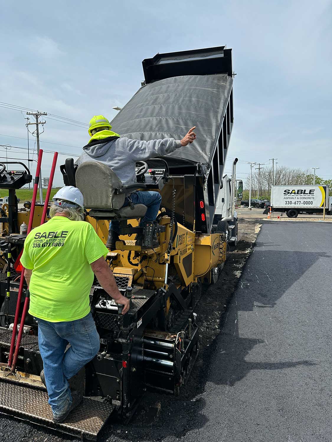 Commercial parking lot paving with even asphalt finish and defined parking layout