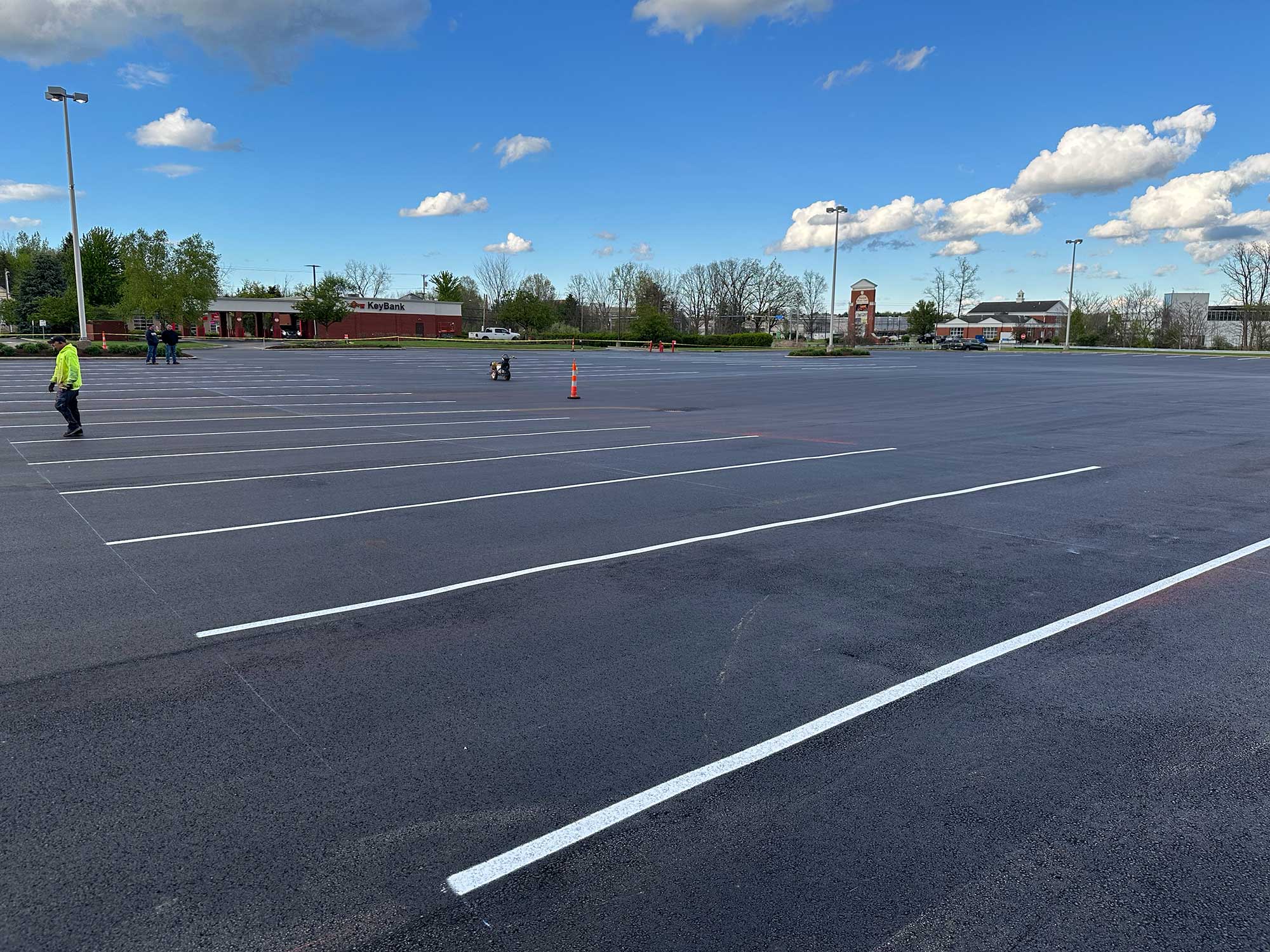 Smooth and durable asphalt parking lot with freshly painted lines expertly paved by Sable Asphalt