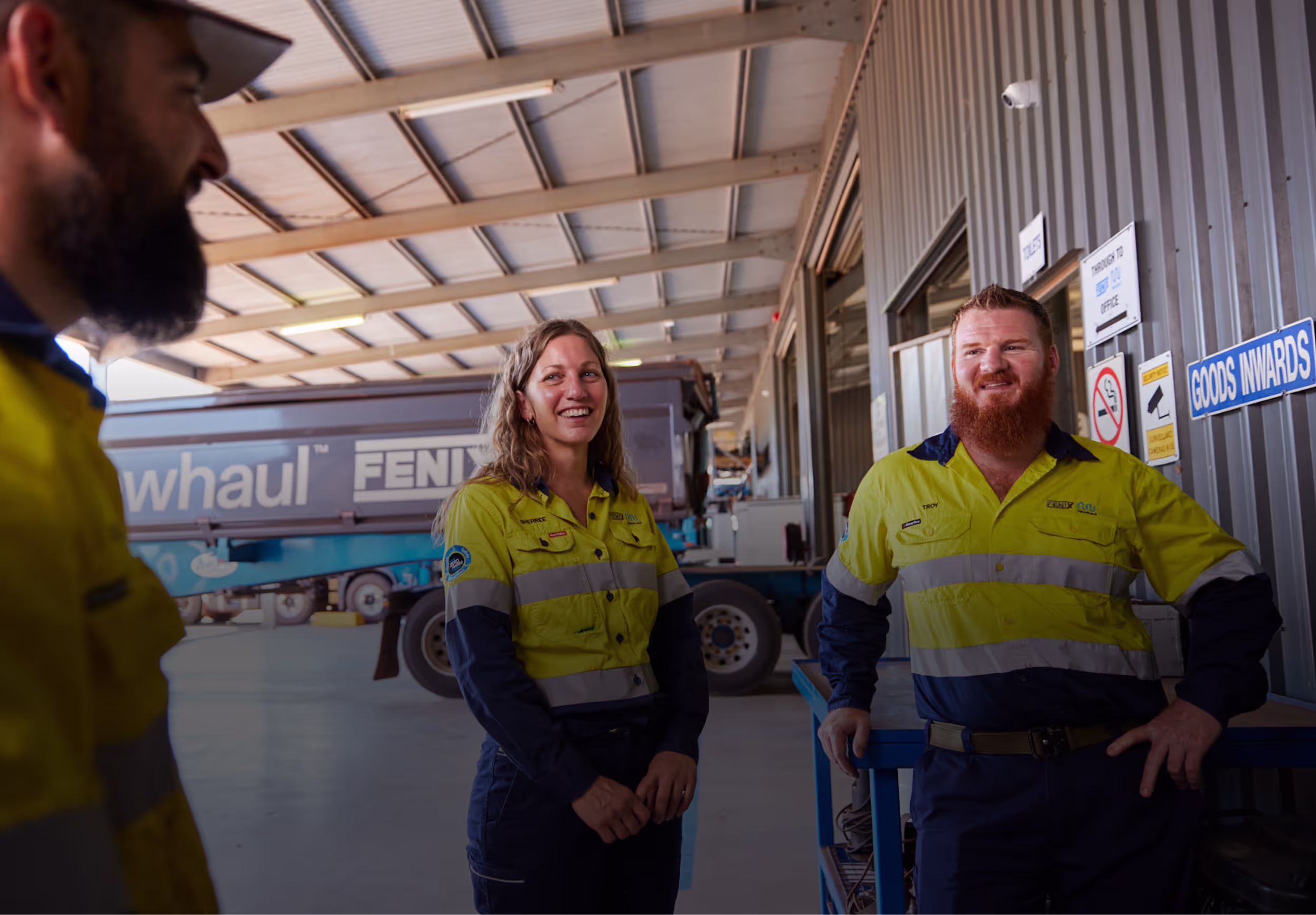 A group of Newhaul staff in Truck workshop
