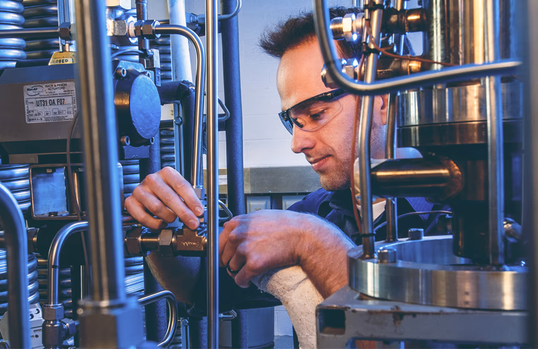 Worker checking computer at installation