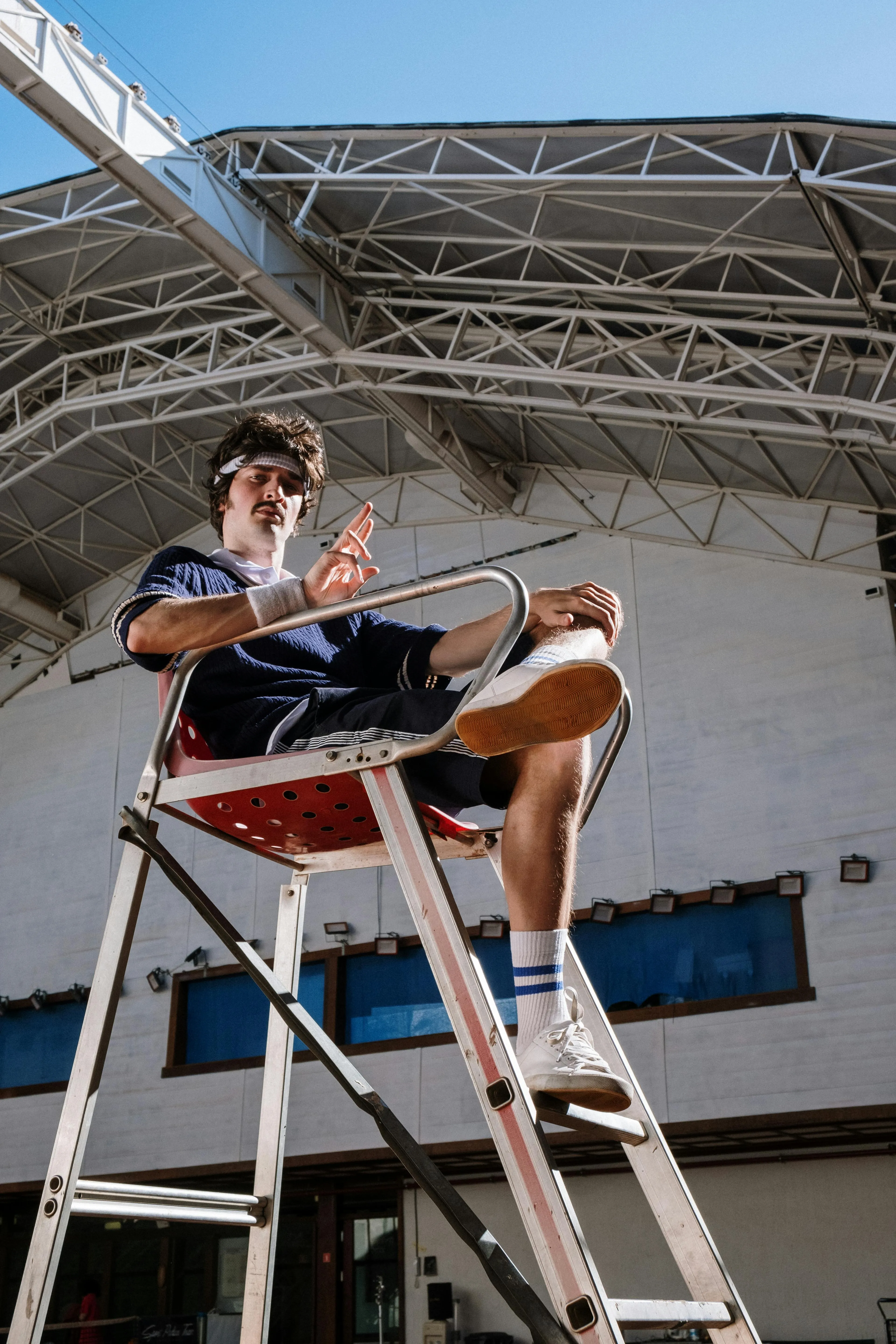 Man Sitting on the Referee Stand